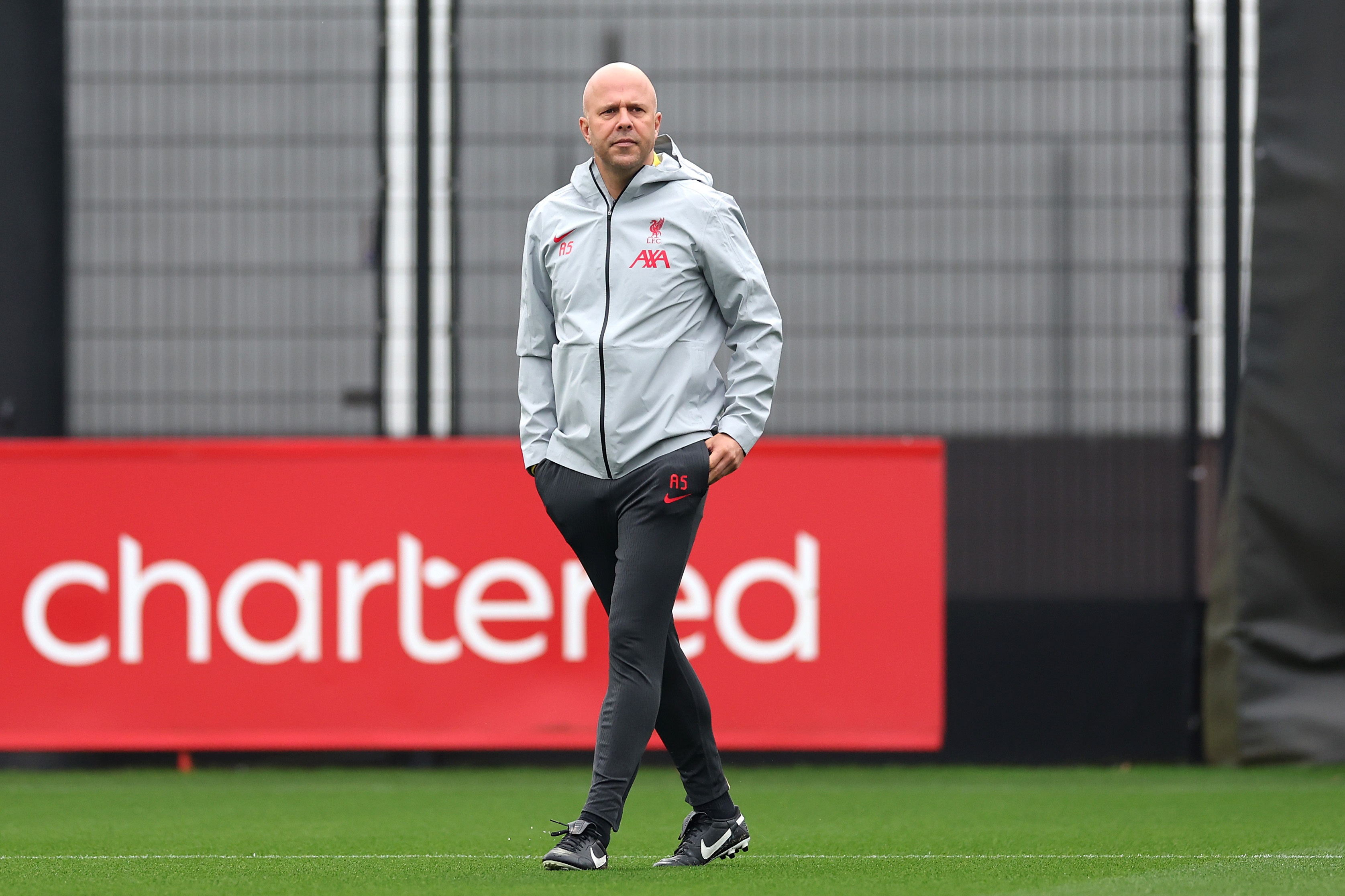 Arne Slot observes his Liverpool side in training.