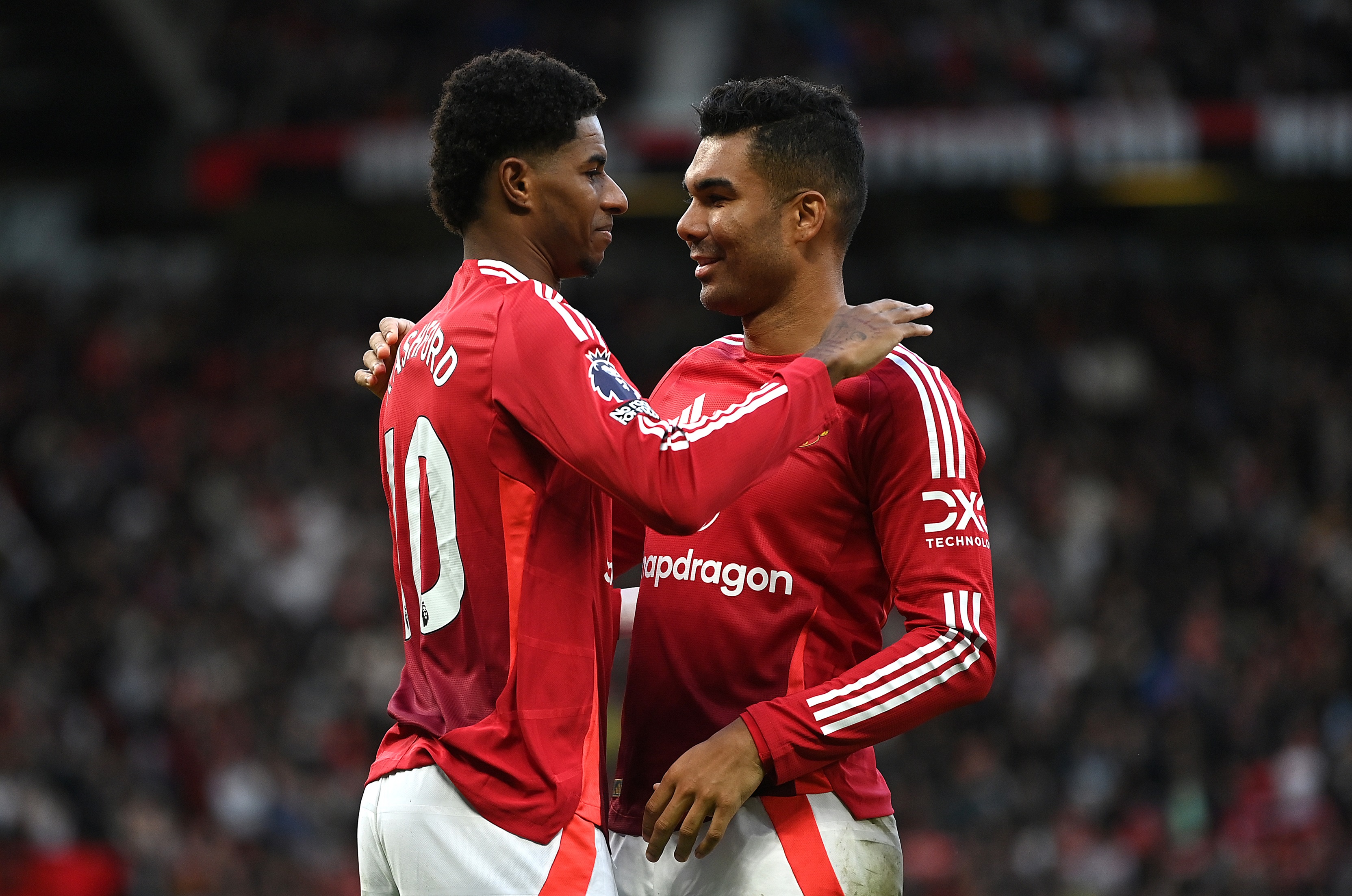 Marcus Rashford celebrates with Casemiro after scoring against Everton at Old Trafford.