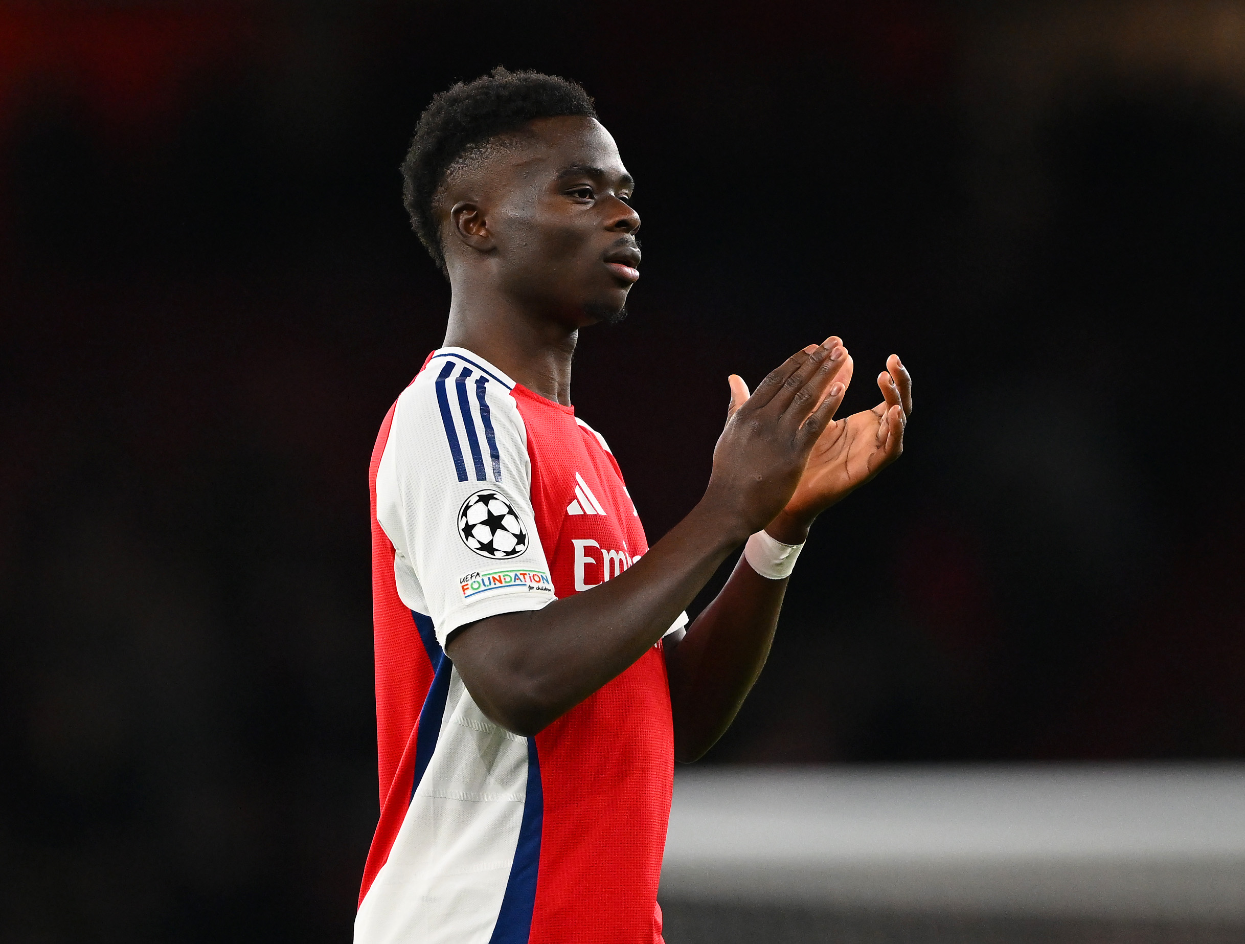 Bukayo Saka of Arsenal applauds the fans