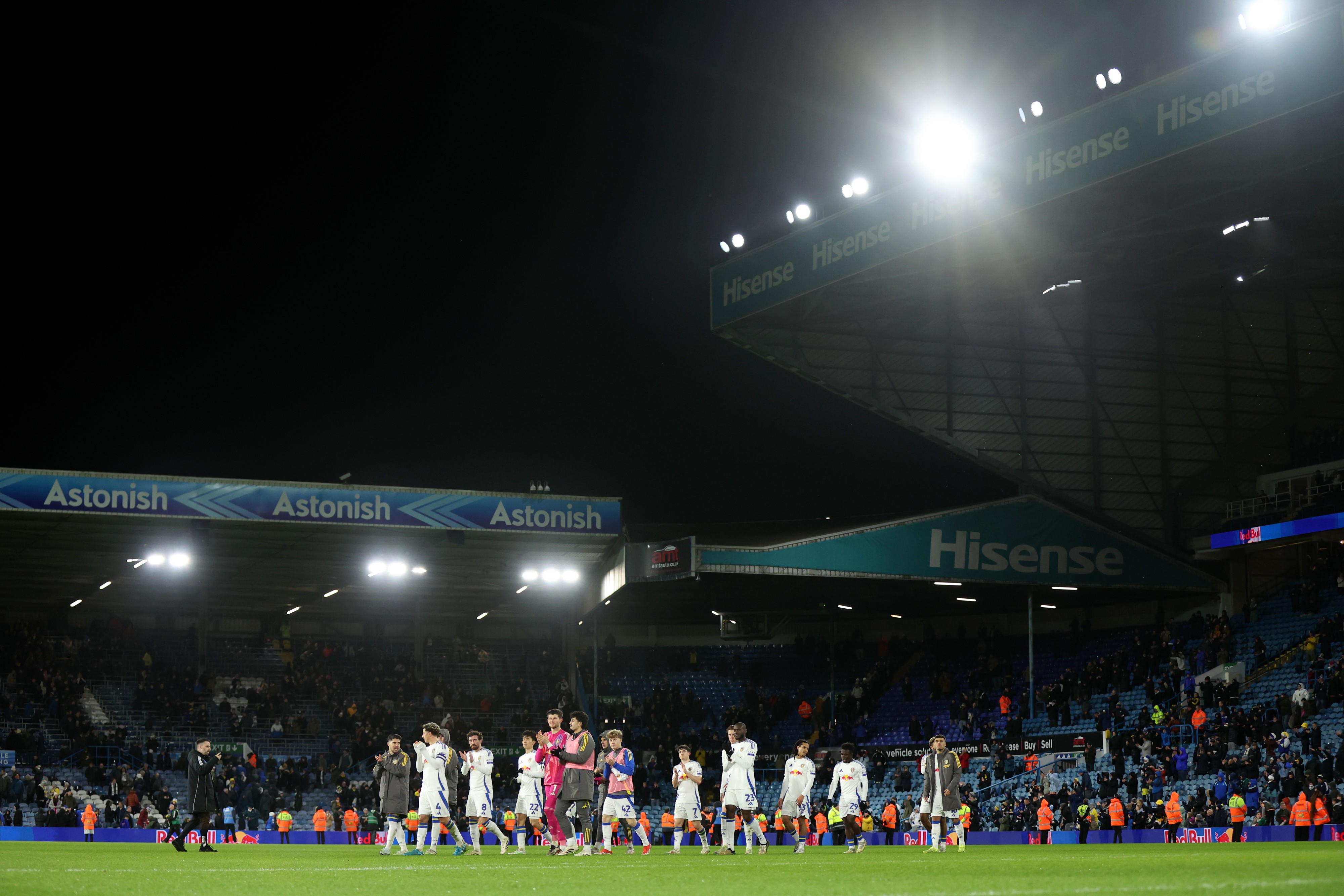 Leeds United team applauds the fans