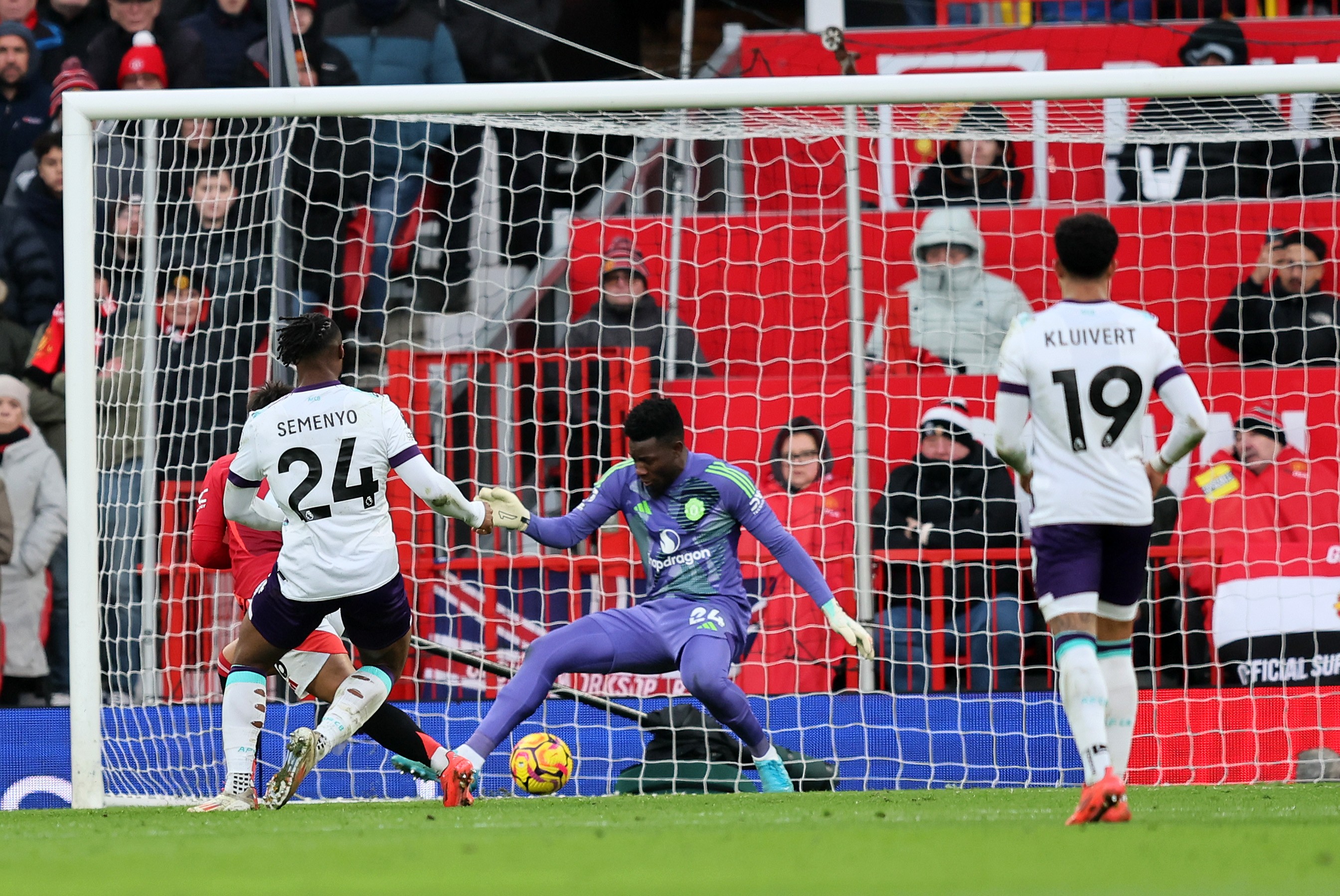 Antoine Semenyo of AFC Bournemouth scores his team's third goal past Andre Onana