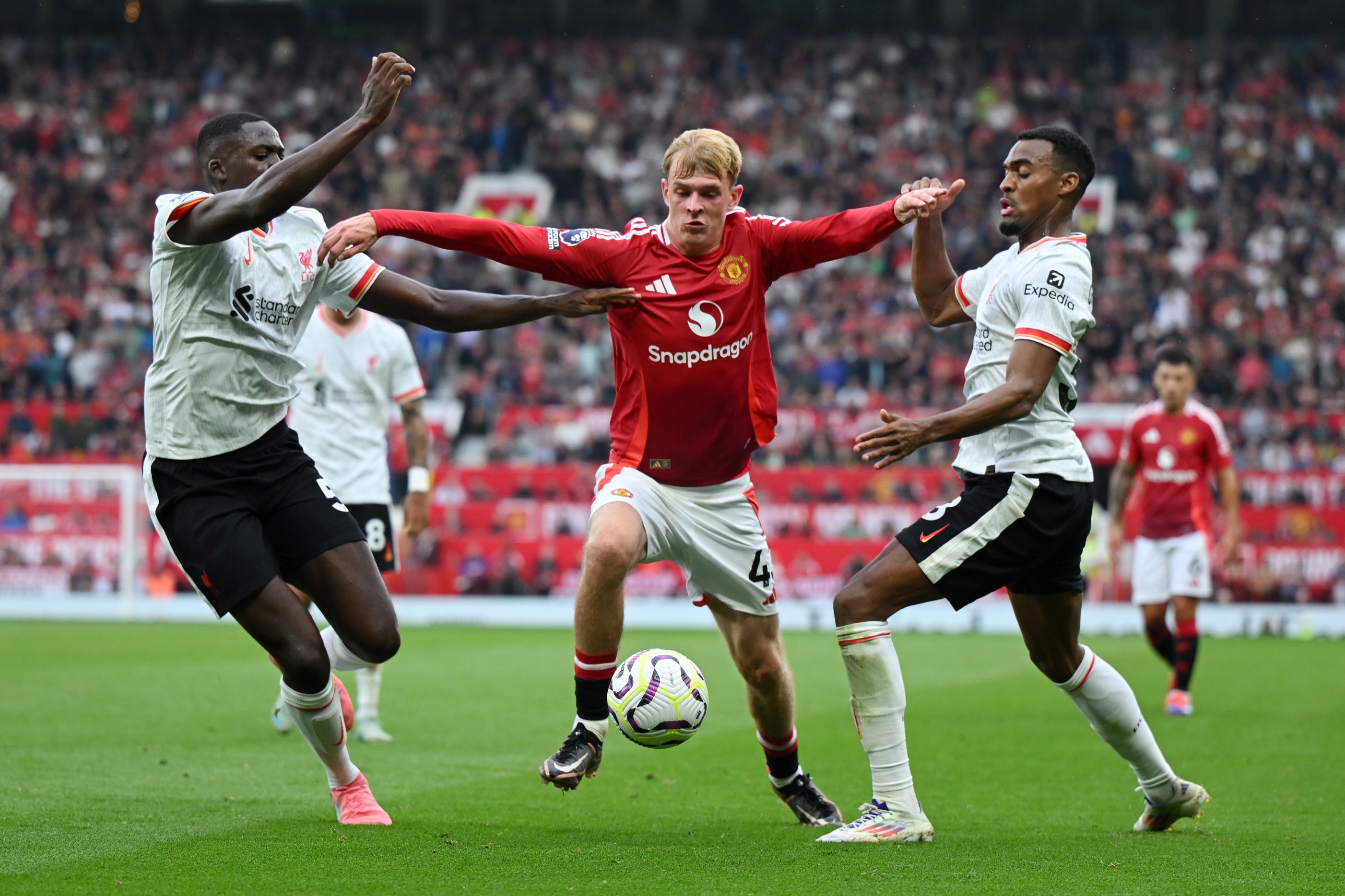 Manchester United's Toby Collyer in action against Liverpool