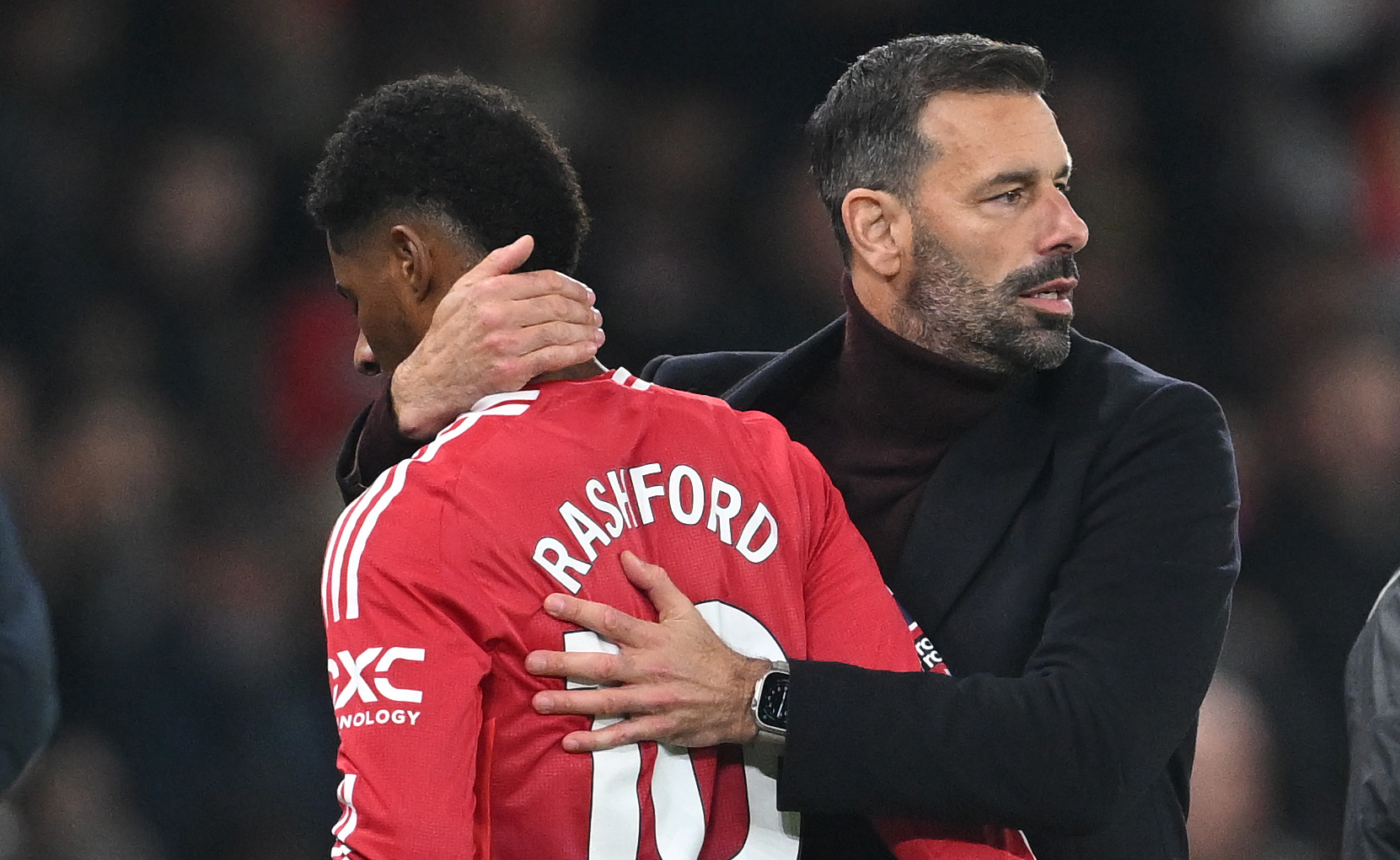 Marcus Rashford of Manchester United is hugged by Ruud van Nistelrooy