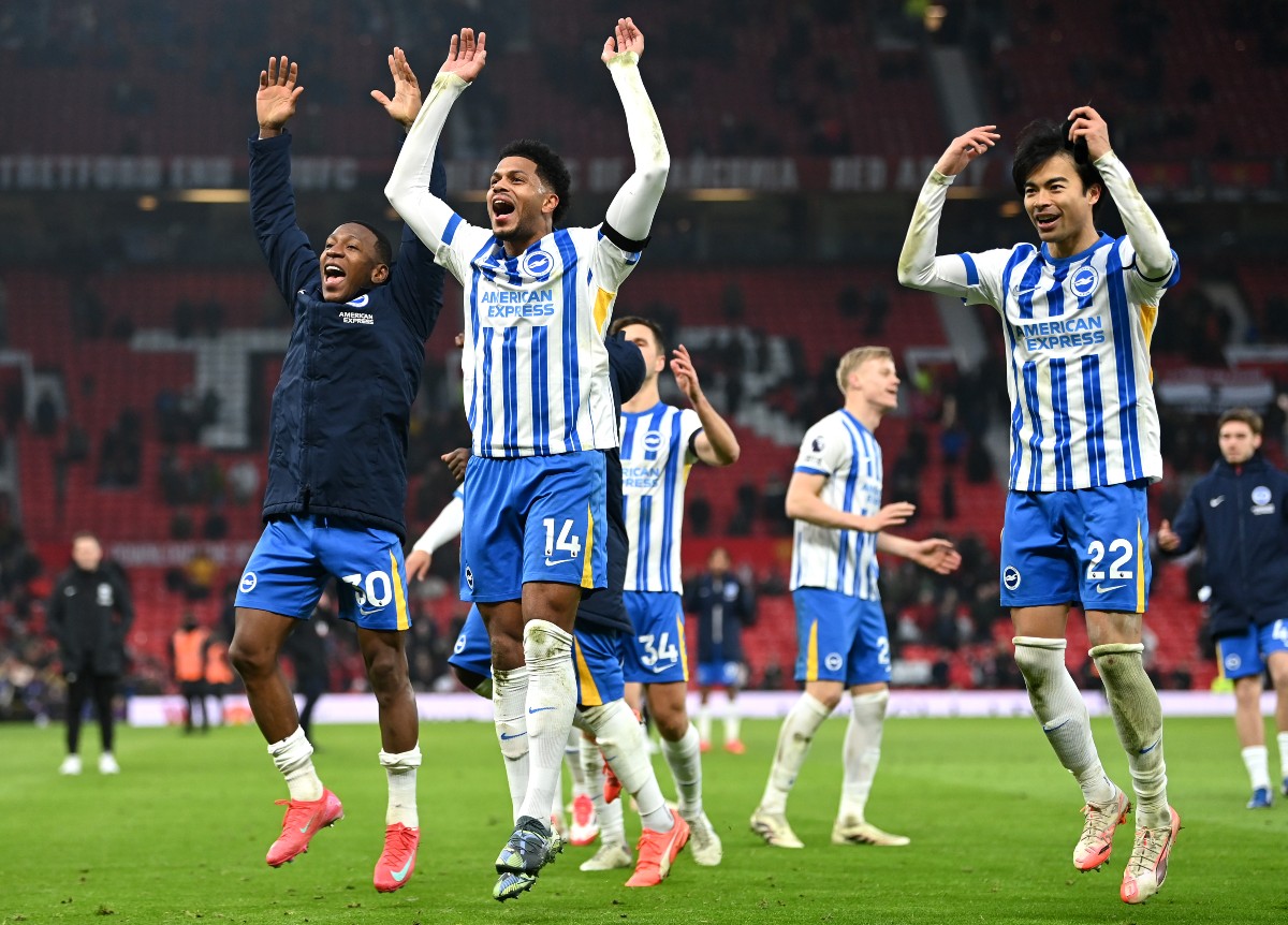 Brighton players celebrate winning at Old Trafford