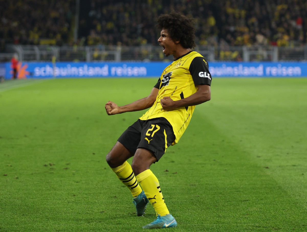 Karim Adeyemi holds a goal for Borussia Dortmund