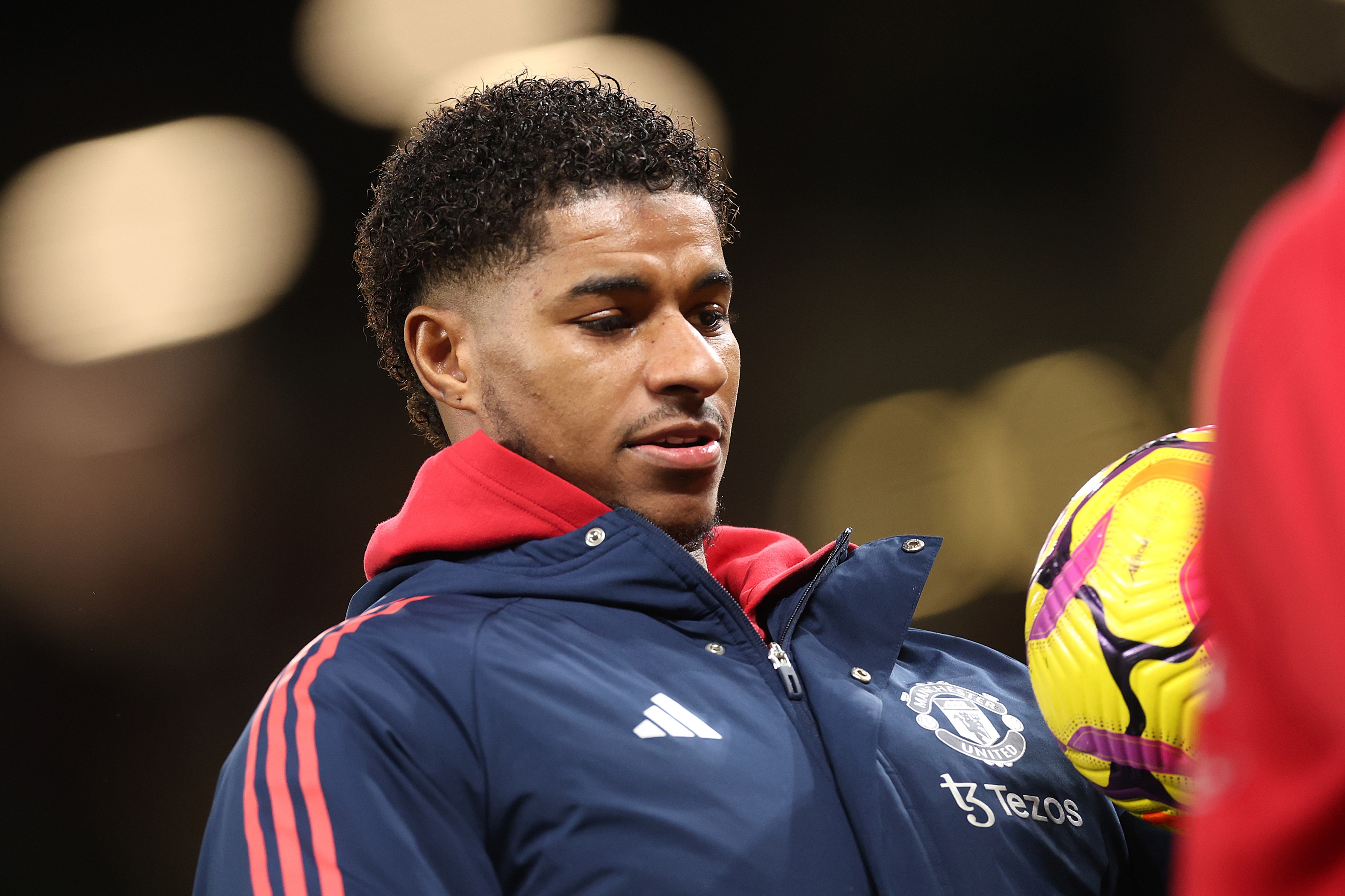 Marcus Rashford warms up with the ball at Old Trafford.