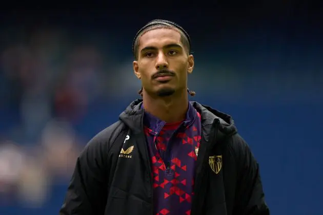 Loic Bade looks on