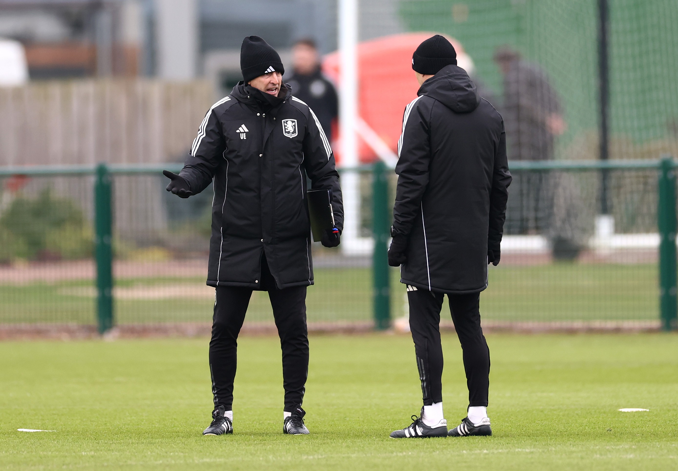 Unai Emery, Manager of Aston Villa, speaks to a member of the coaching staff