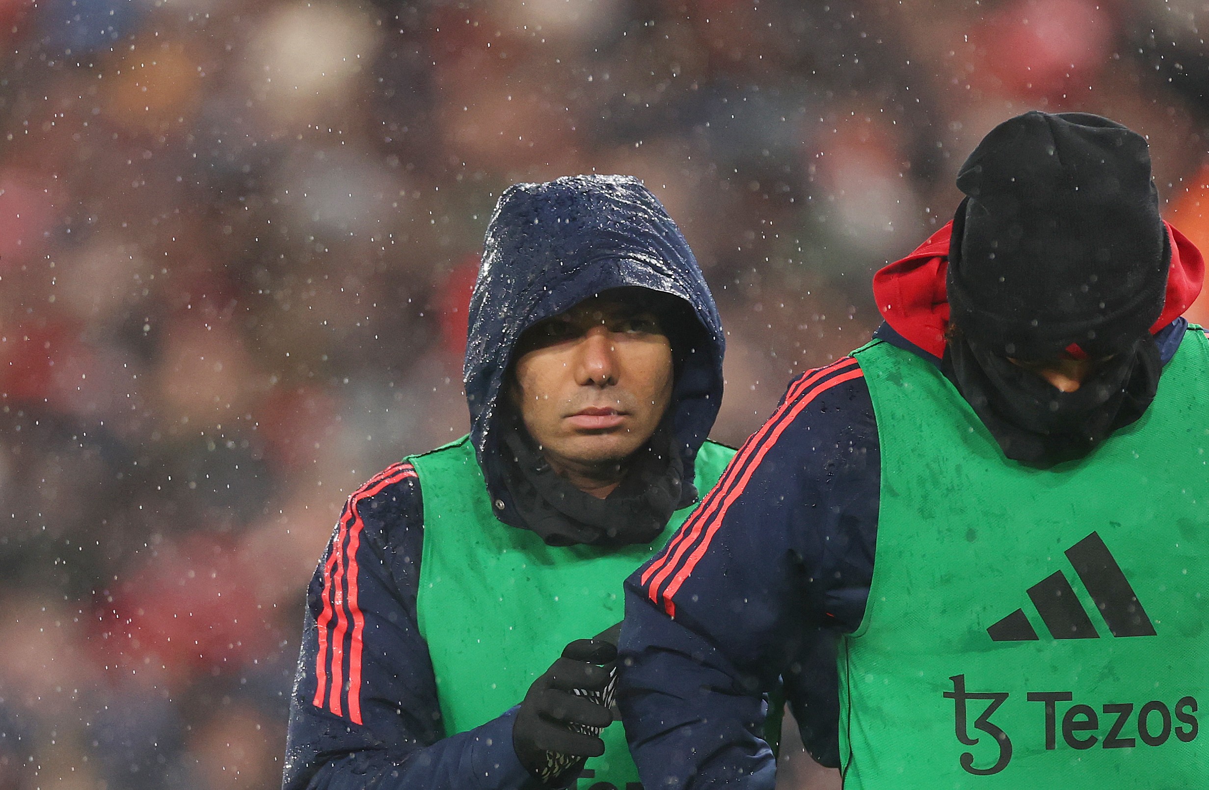 Manchester United's Casemiro warms up on the sidelines