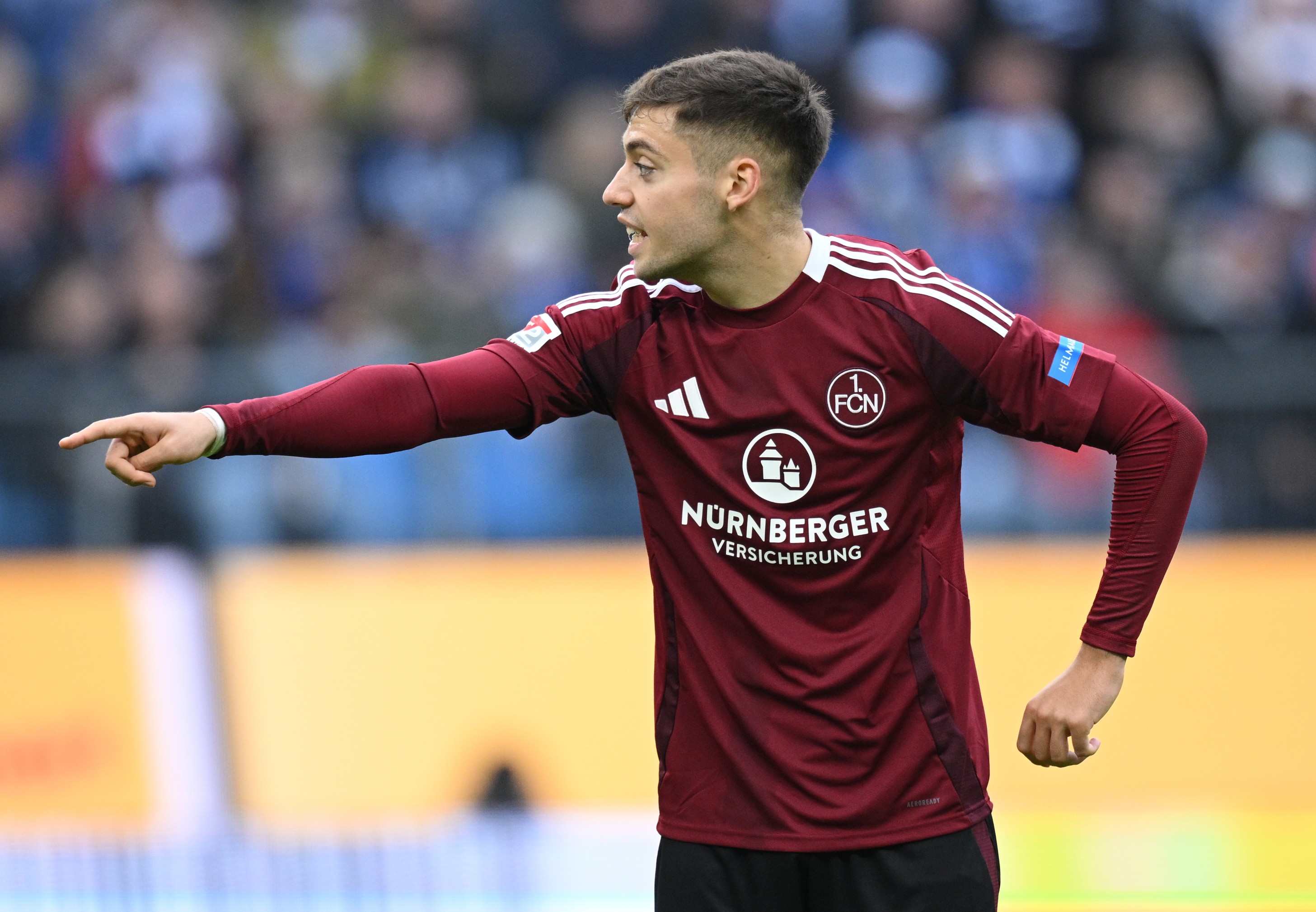 Stefanos Tzimas of Nuernberg points to a teammate