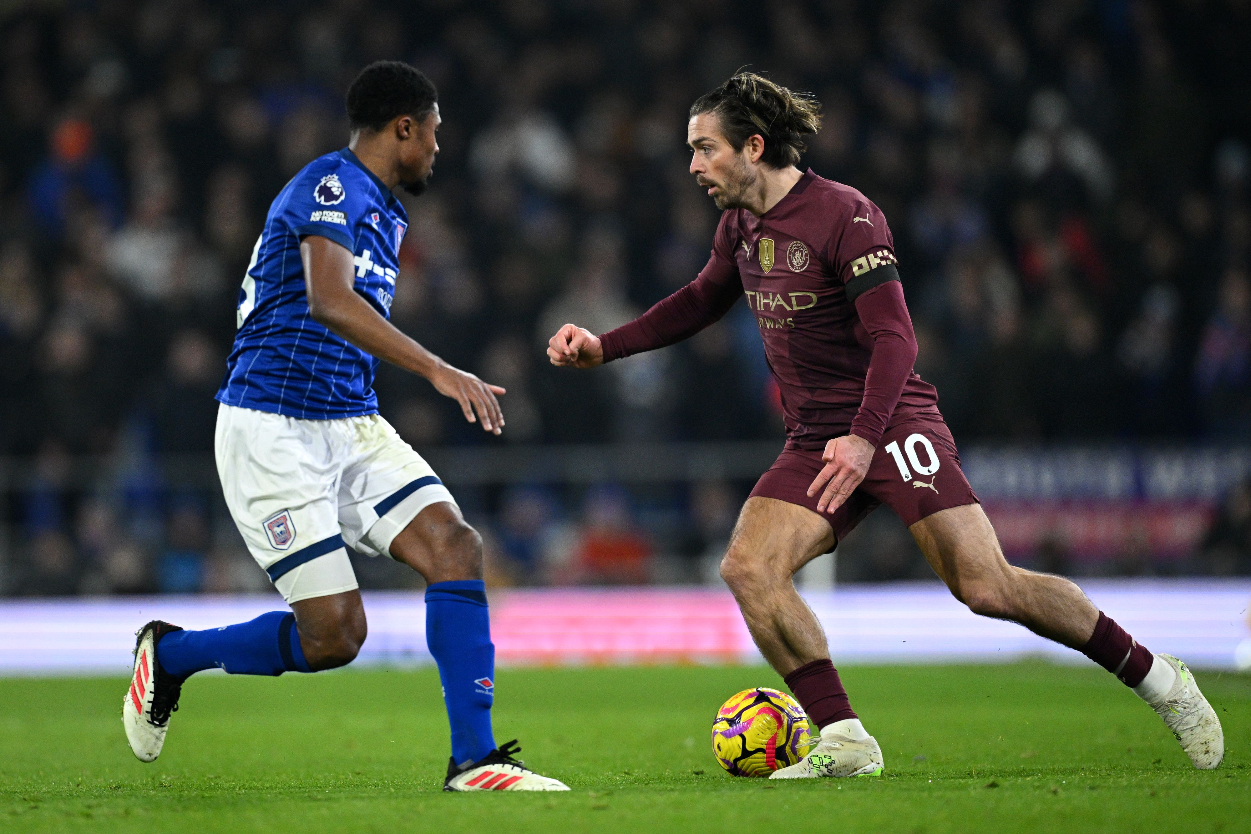 Jack Grealish from Manchester City faces Ben Johnson from Ipswich Town.