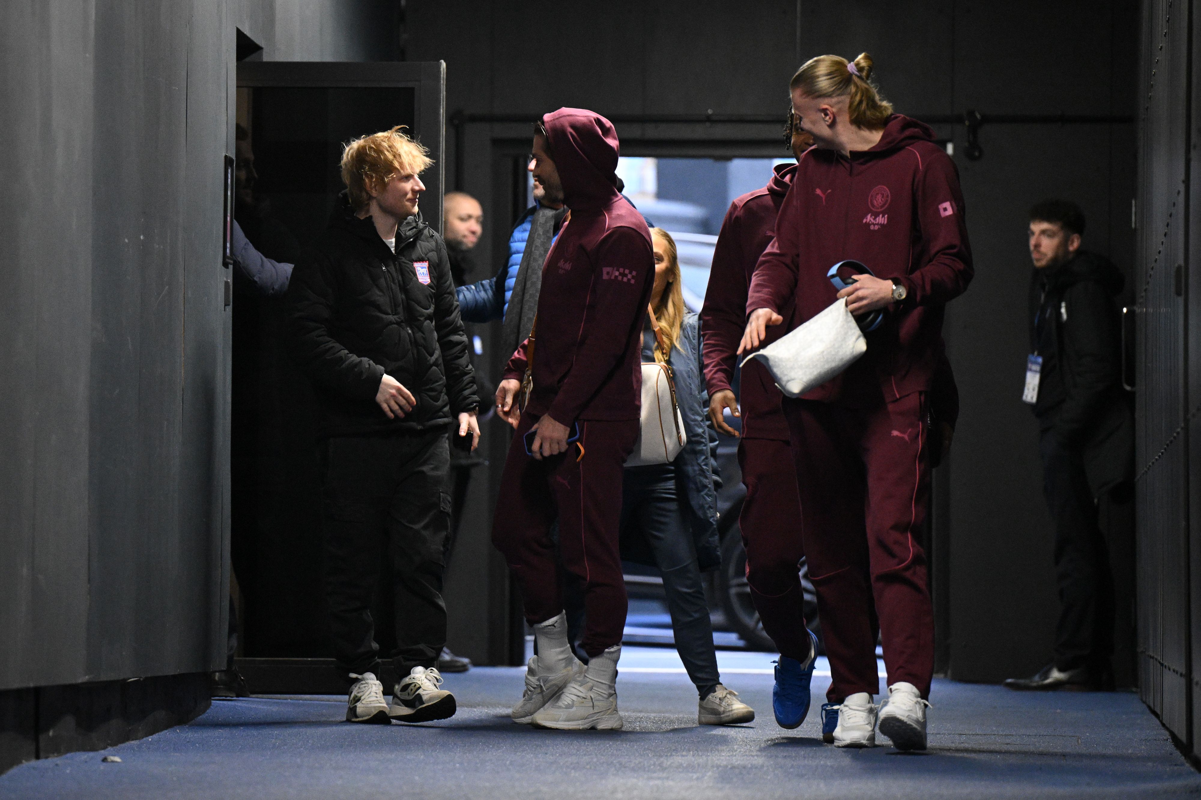 Singer/songwriter and Ipswich Town minority shareholder and sponsor Ed Sheeran talks to Manchester City's Jack Grealish.