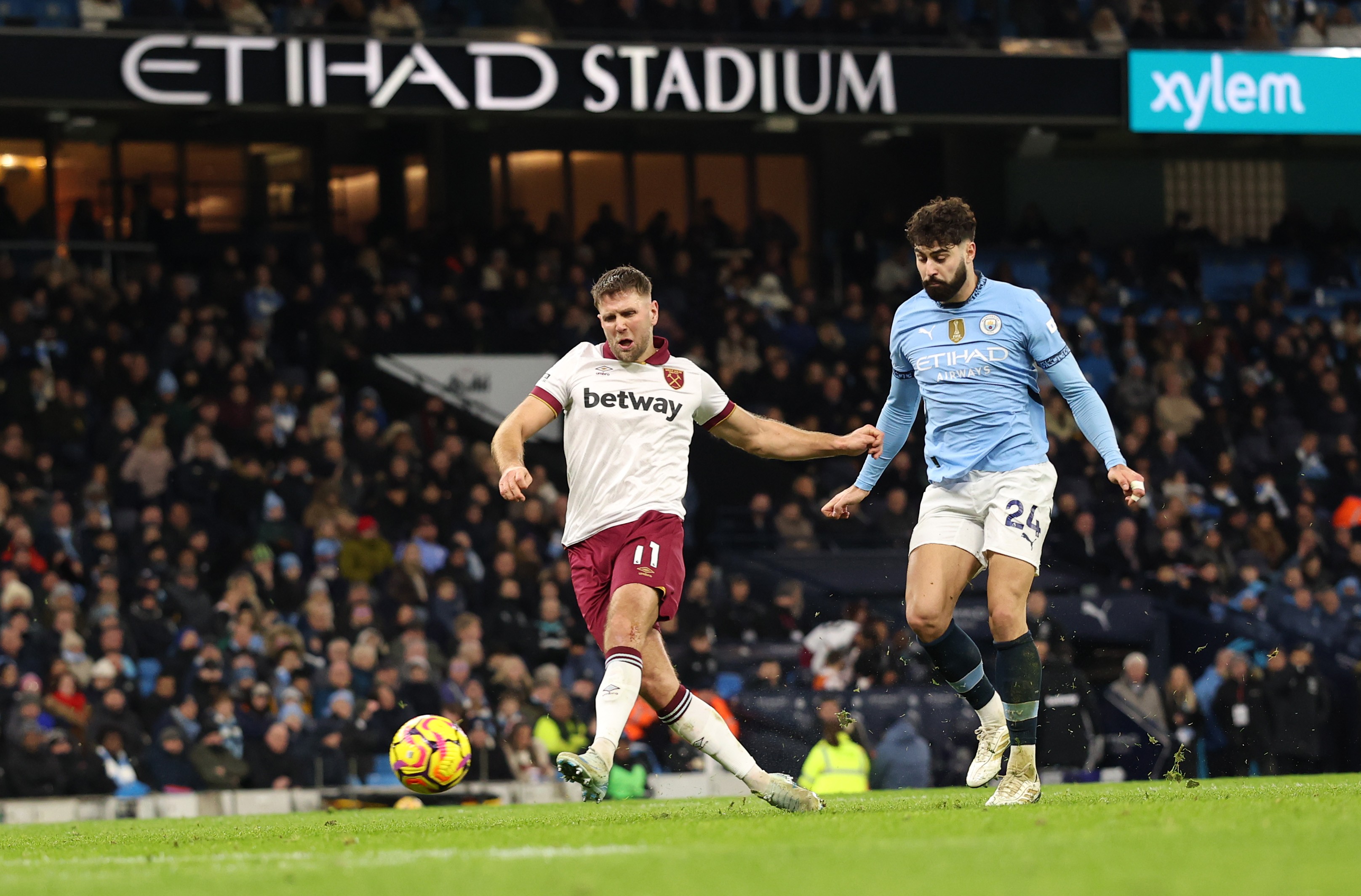 Niclas Fullkrug of West Ham United scores his team's first goal against Manchester City.