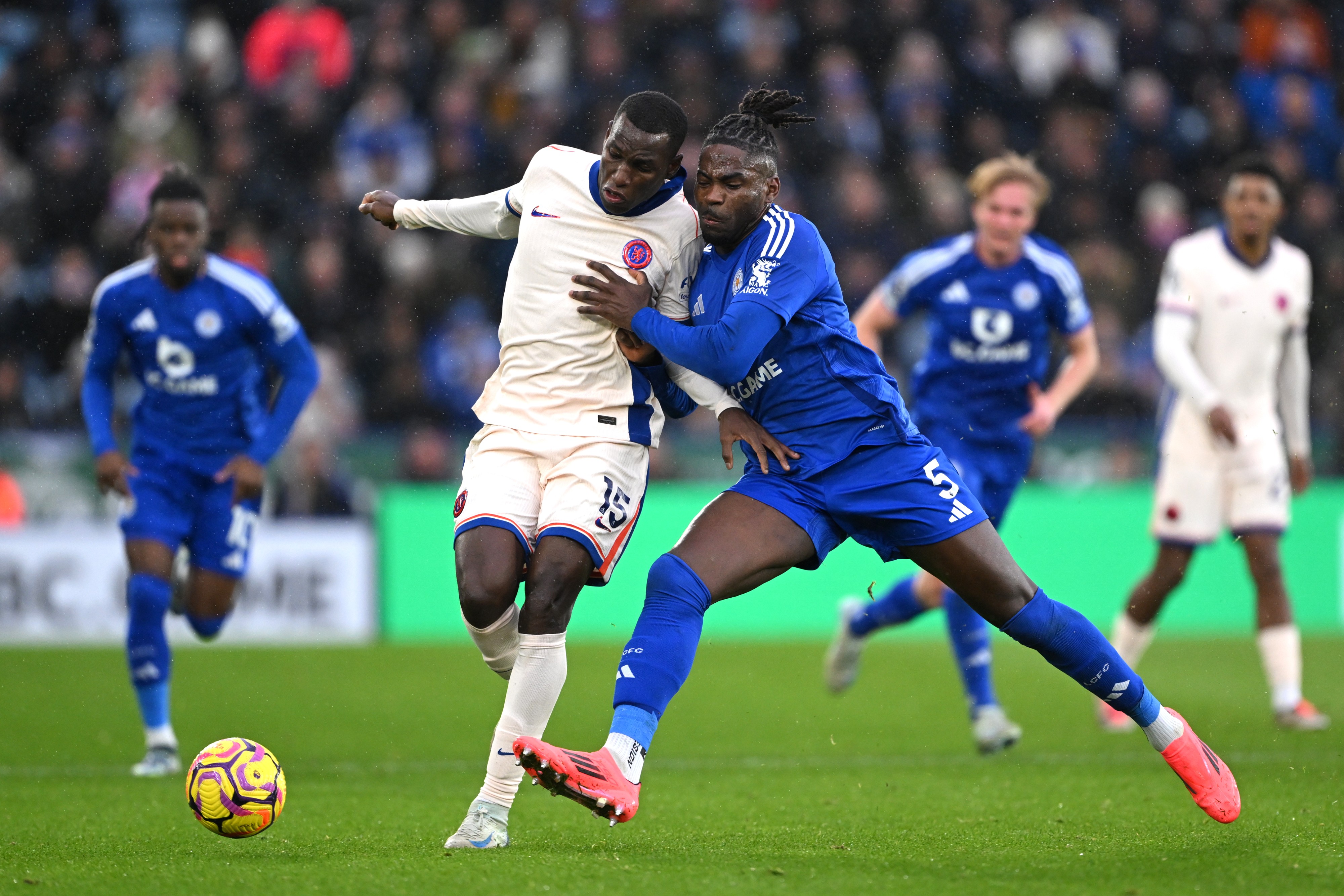 Nicolas Jackson of Chelsea is challenged by Caleb Okoli of Leicester City