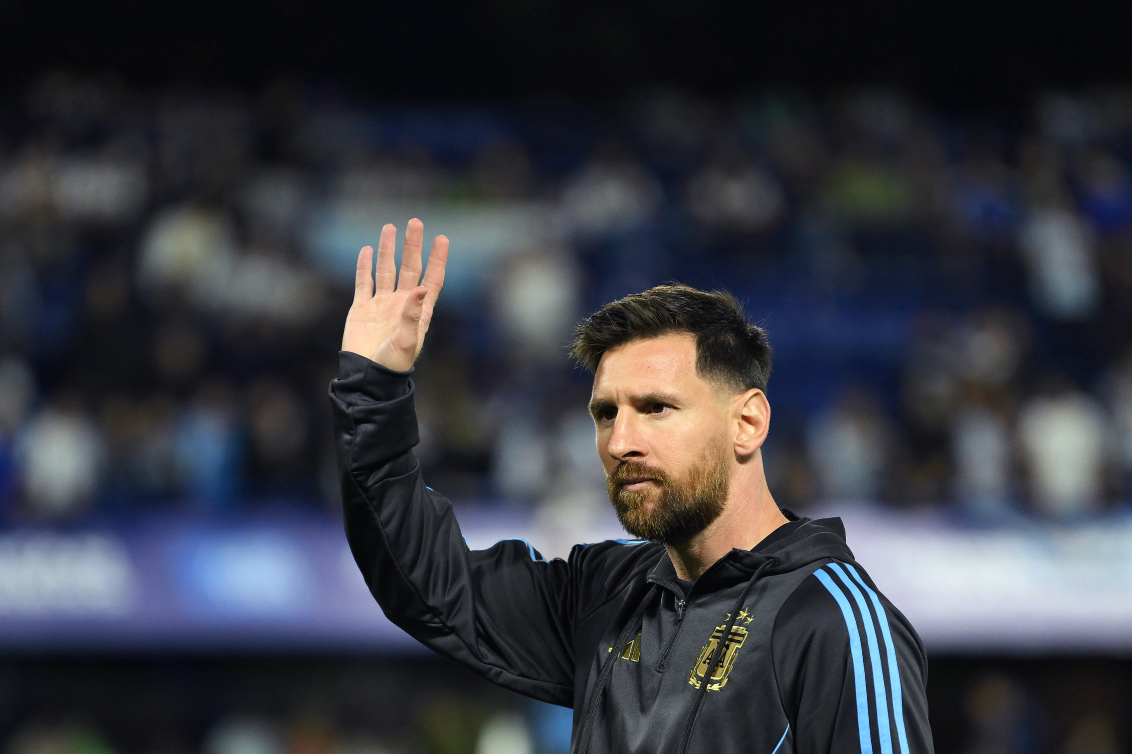 Lionel Messi of Argentina waves to fans