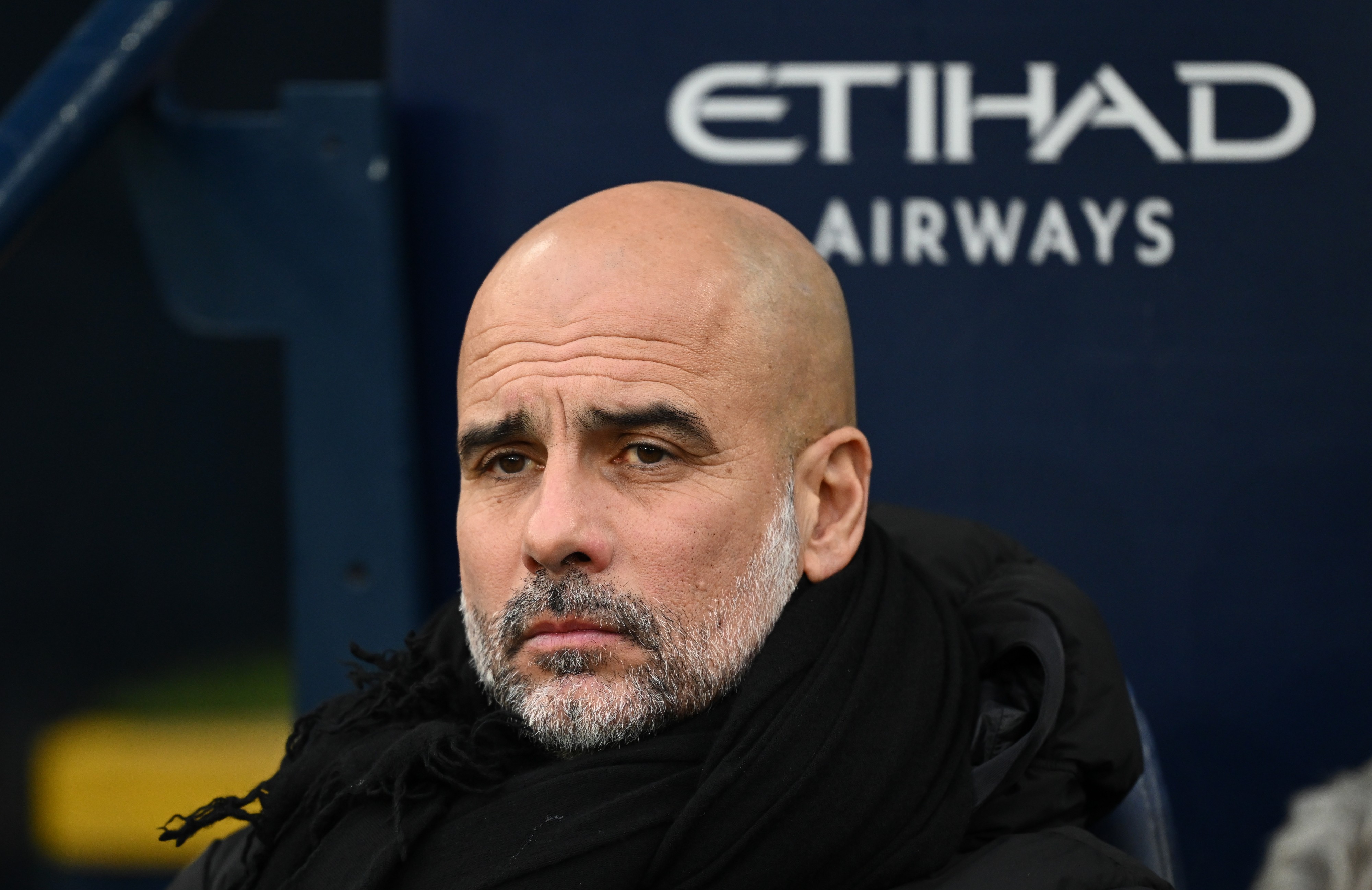 Manchester City manager Pep Guardiola looks on