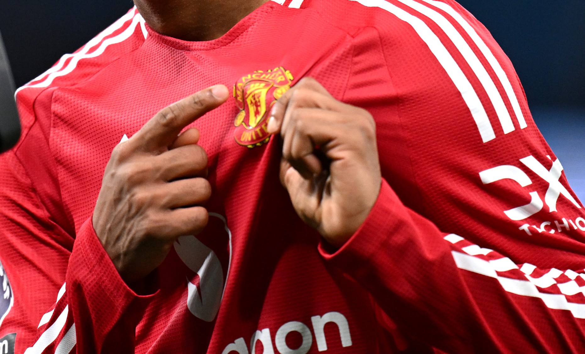 Amad Diallo of Manchester United gestures to the badge