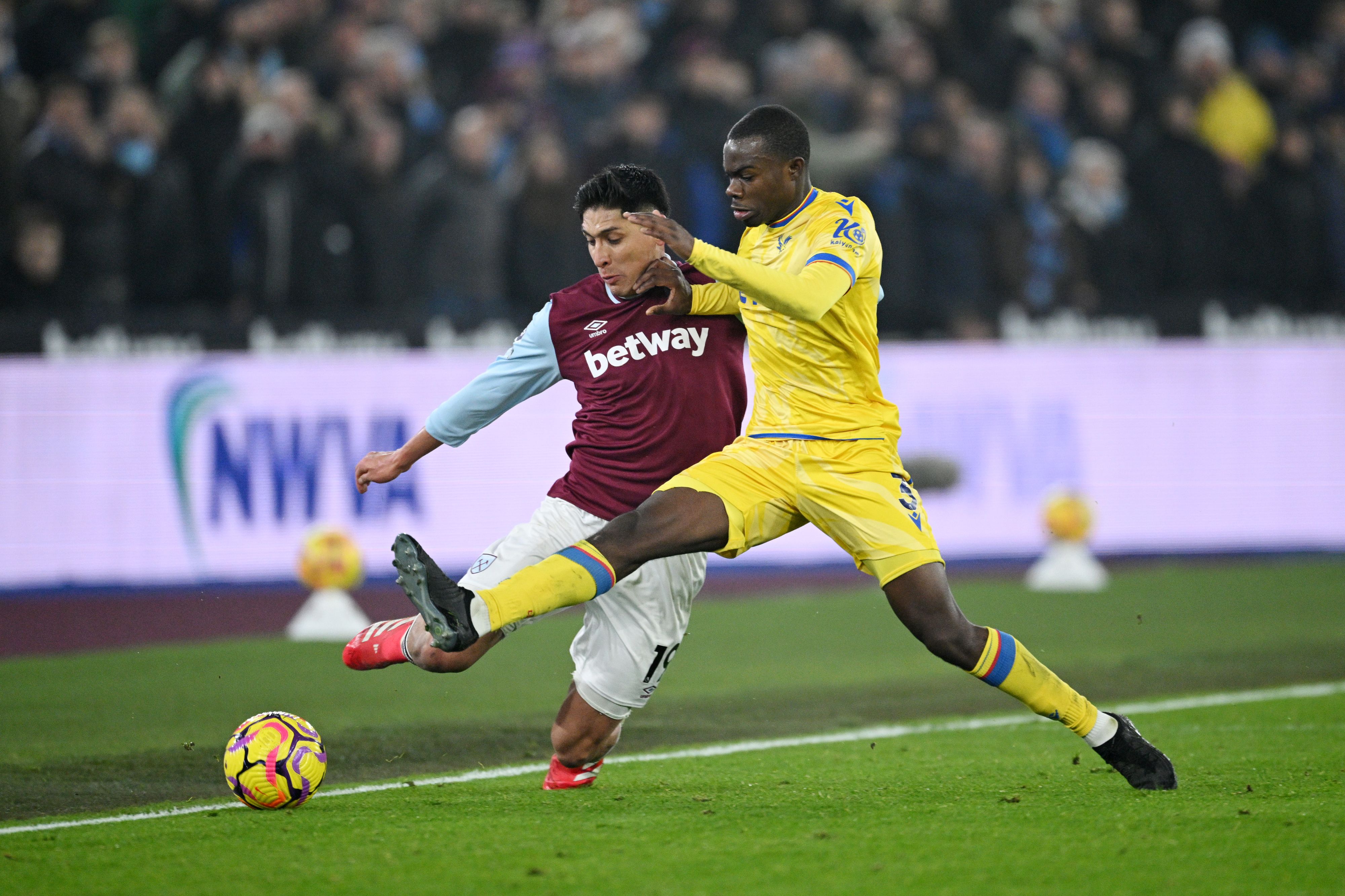 Edson Alvarez of West Ham United is challenged by Tyrick Mitchell of Crystal Palace.