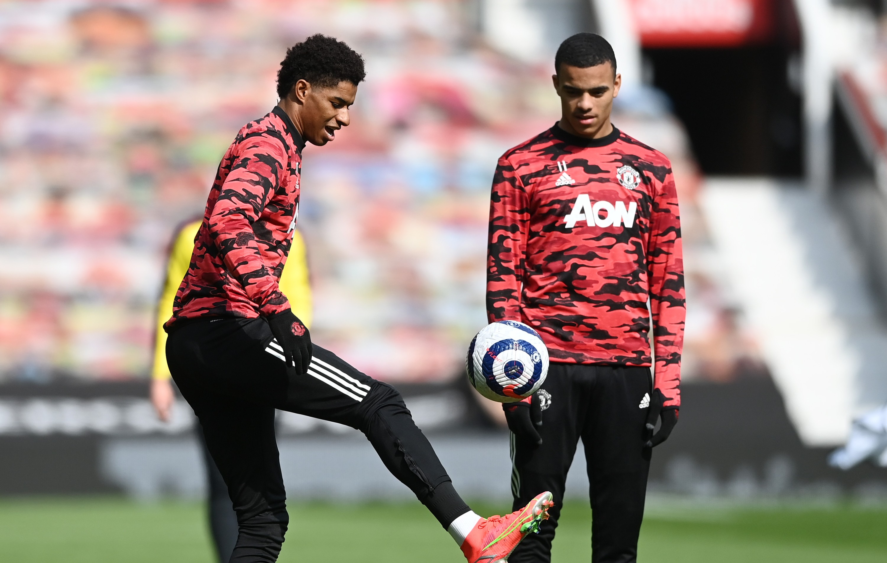 Marcus Rashford and Mason Greenwood of Manchester United warm up prior to the Premier League match against Burnley.