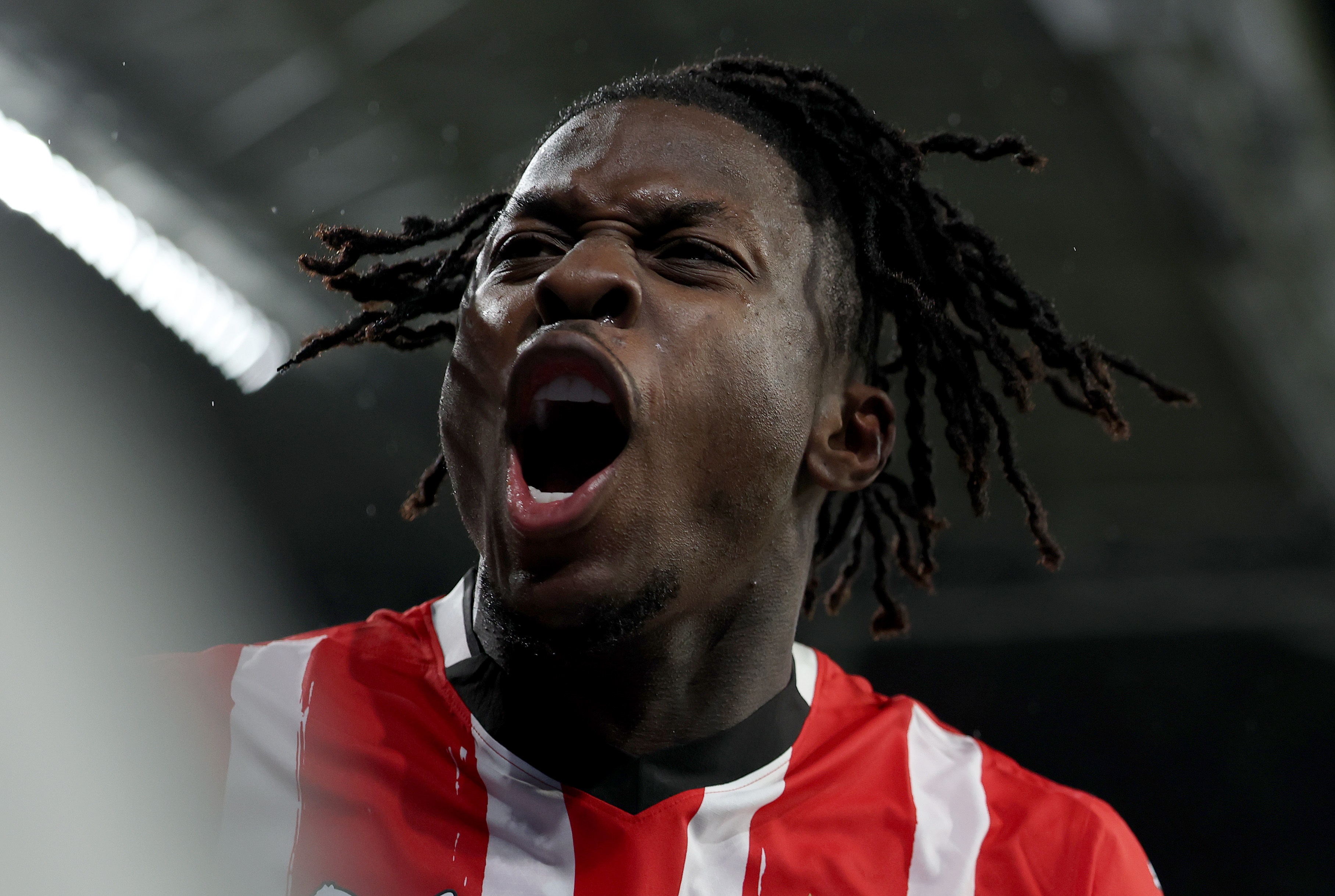 Johan Bakayoko celebrates scoring a goal for PSV.