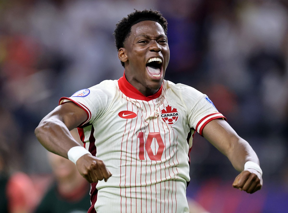 Jonathan David celebrates scoring for Canada