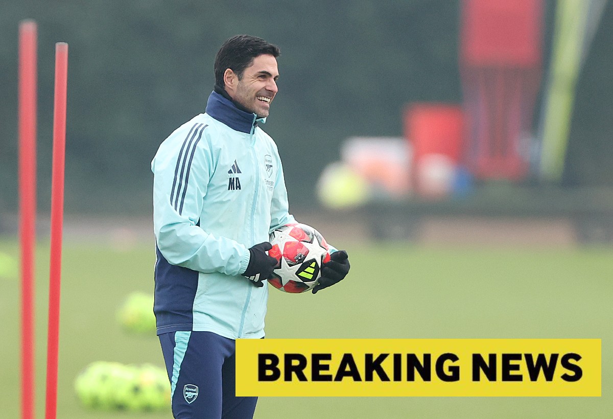 Mikel Arteta smiles during an Arsenal training session