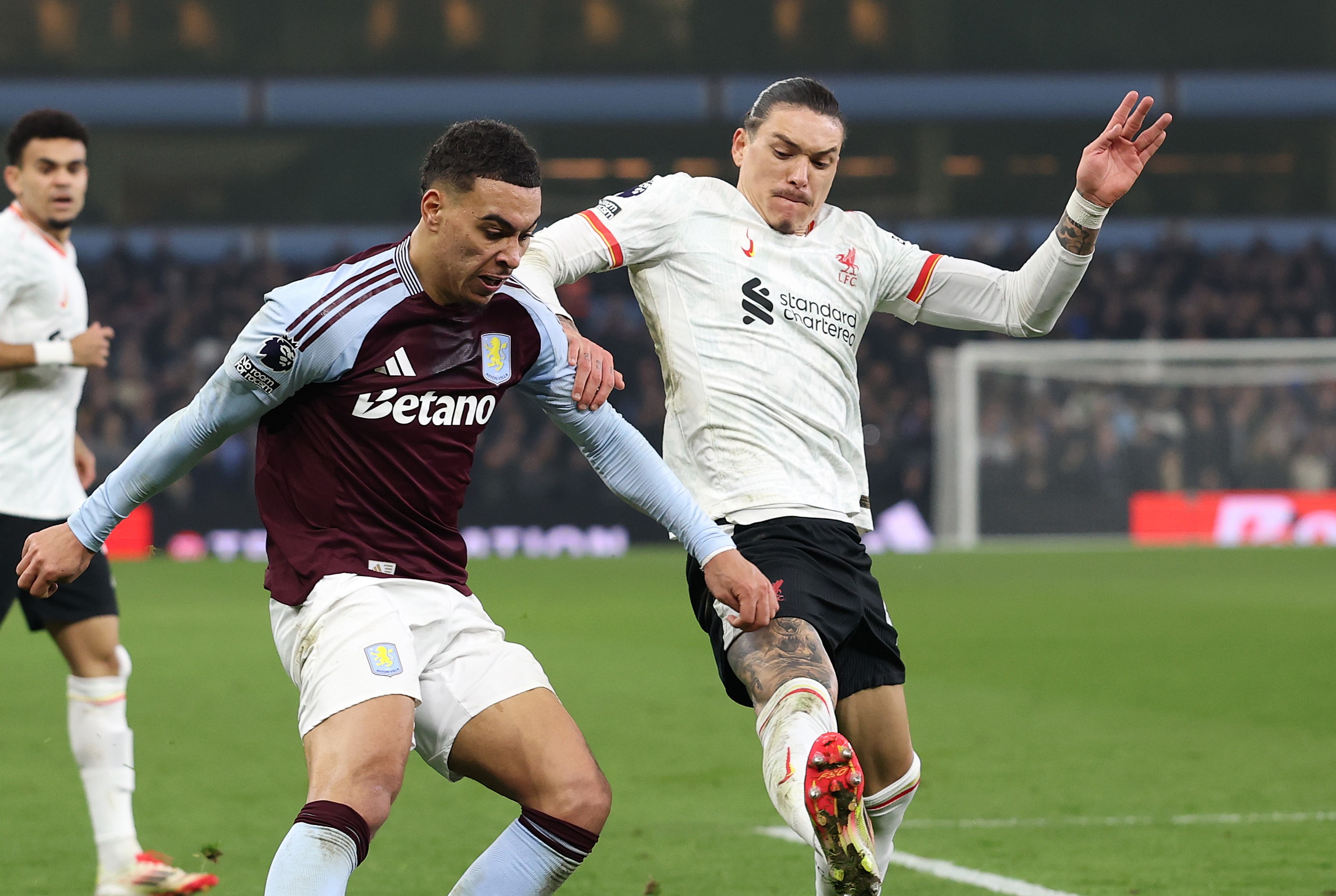 Morgan Rogers of Aston Villa is challenged by Darwin Nunez of Liverpool