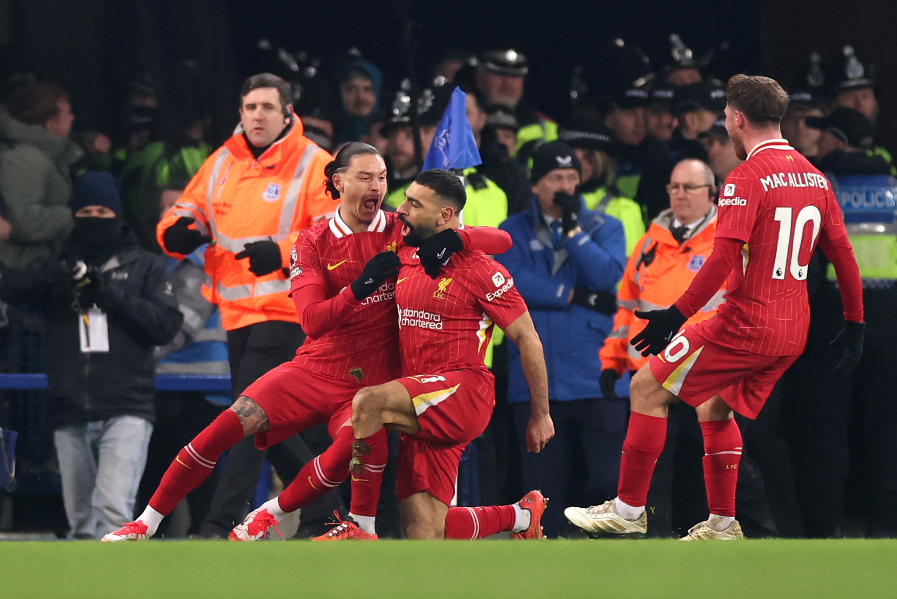 Mohamed Salah of Liverpool celebrates with teammates Darwin Nunez and Alexis Mac Allister