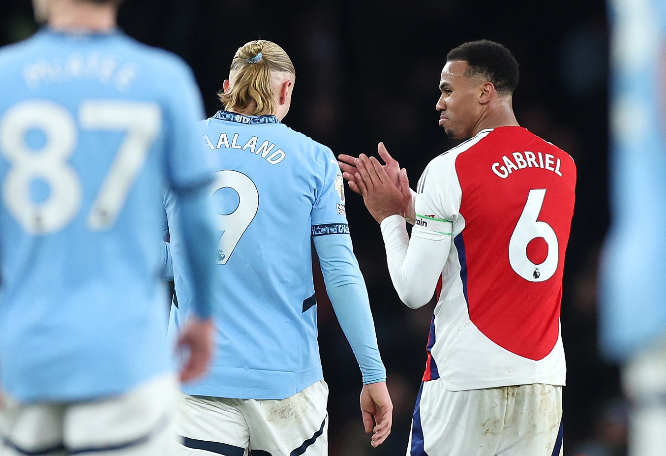 Arsenal defender Gabriel with Man City striker Erling Haaland