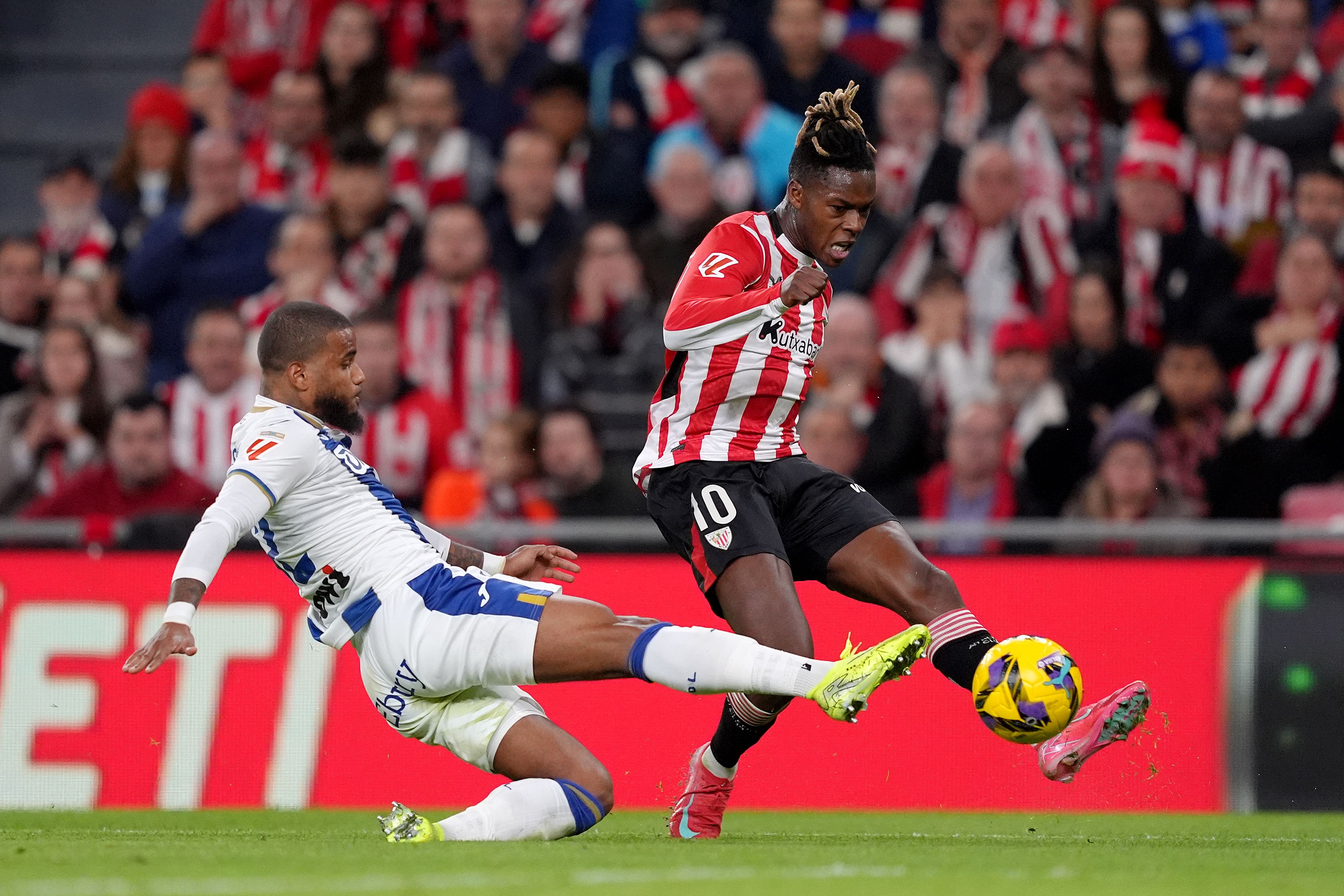 Nico Williams of Athletic Club is challenged by Valentin Rosier of CD Leganes.