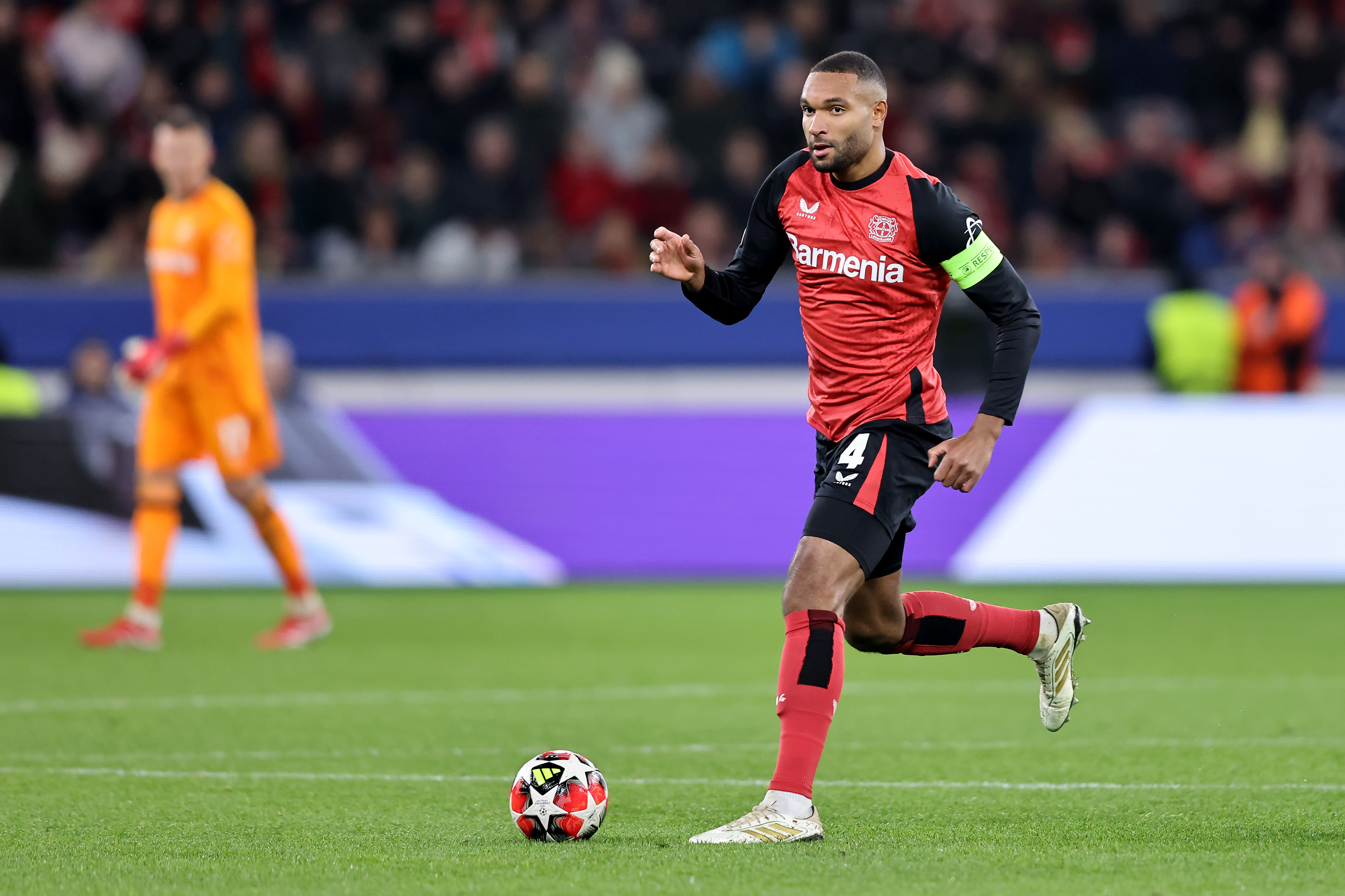 Jonathan Tah of Leverkusen runs with the ball