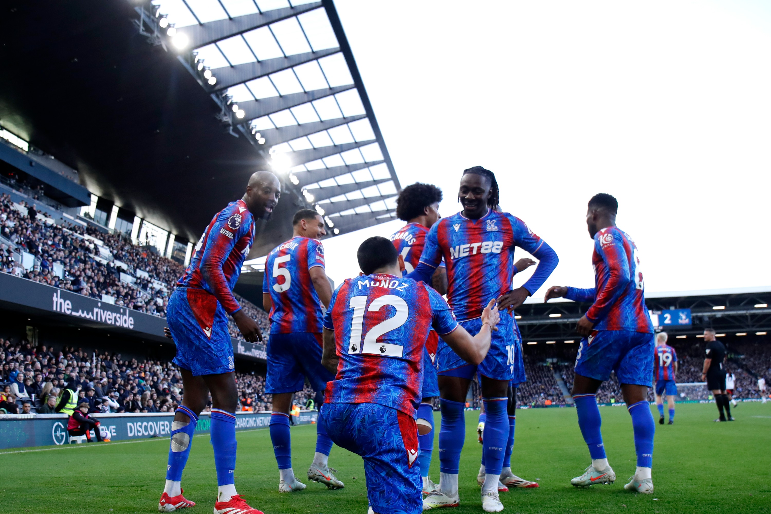 Daniel Munoz of Crystal Palace celebrates scoring his team's second goal with teammate Eberechi Eze