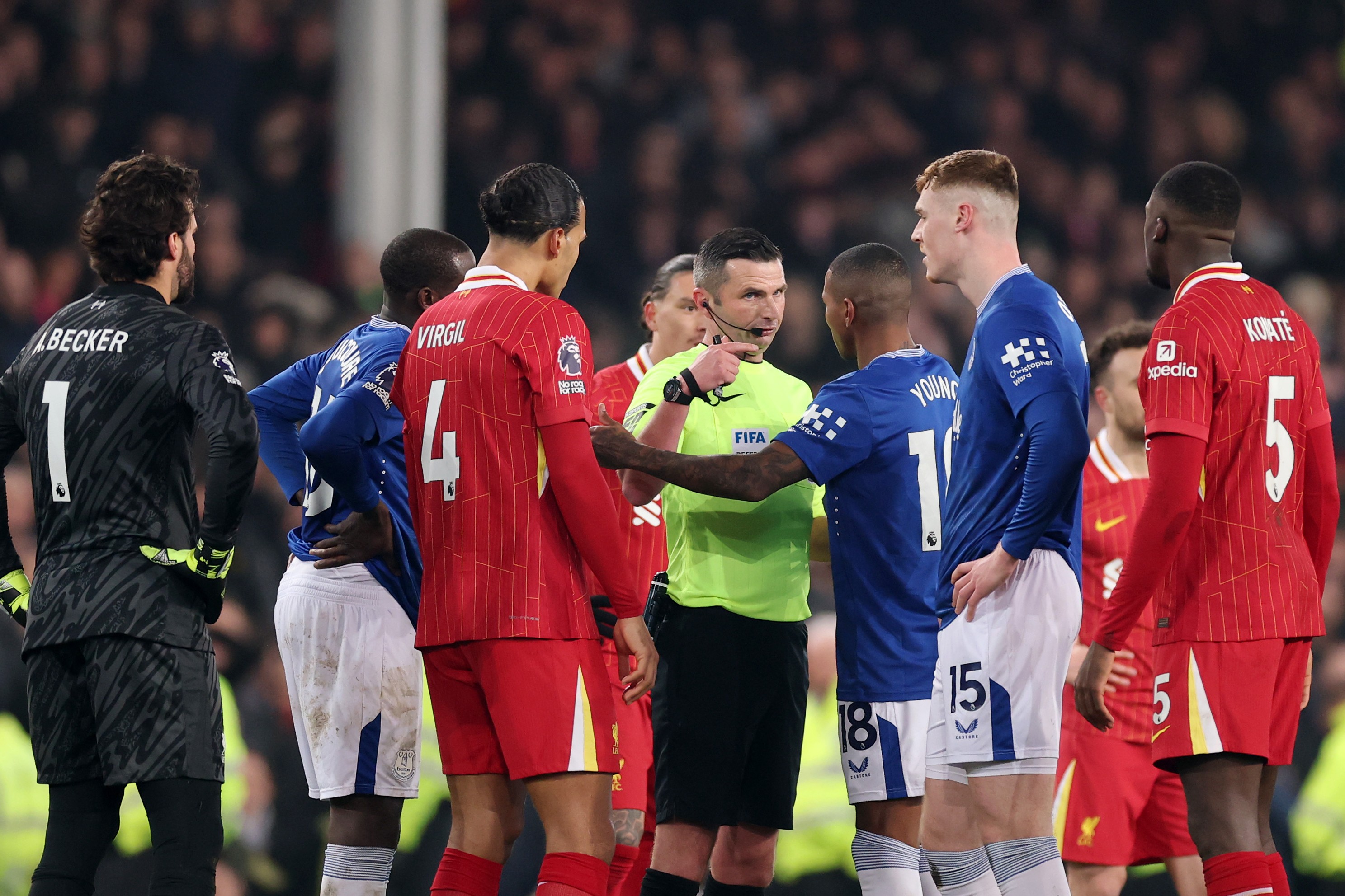 Virgil Van Dijk of Liverpool and Ashley Young of Everton Surround Judge, Michael Oliver