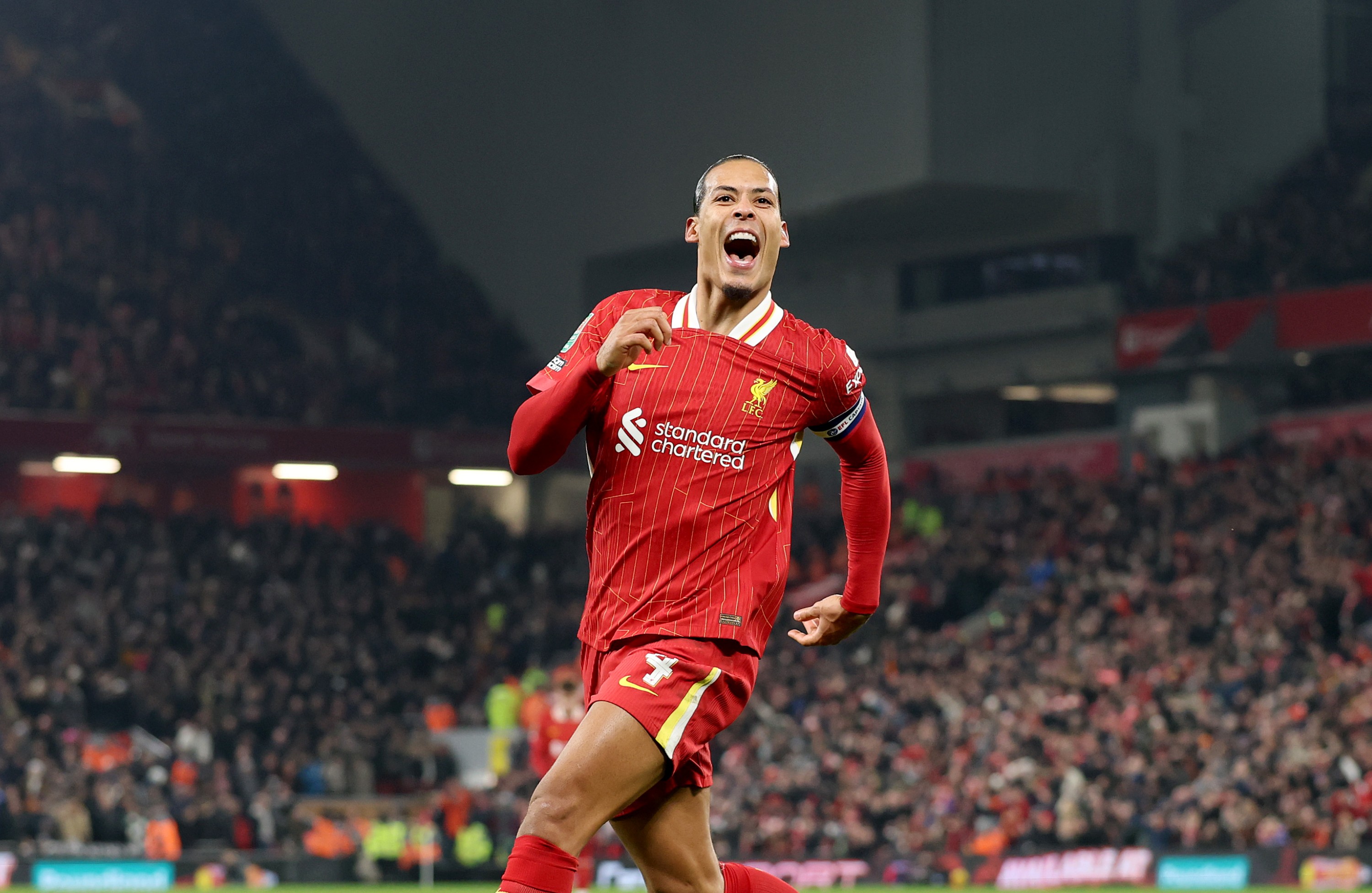 Virgil van Dijk of Liverpool celebrates scoring his team's fourth goal during the Carabao Cup Semi Final Second Leg match against Tottenham Hotspur