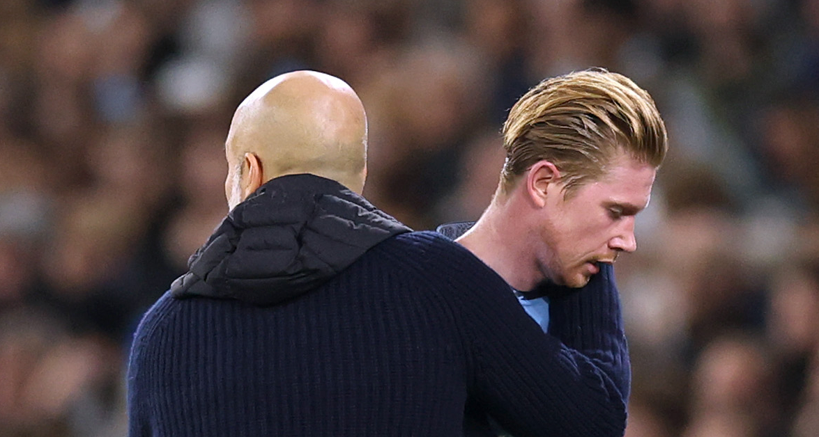 Kevin De Bruyne of Manchester City is embraced by Pep Guardiola