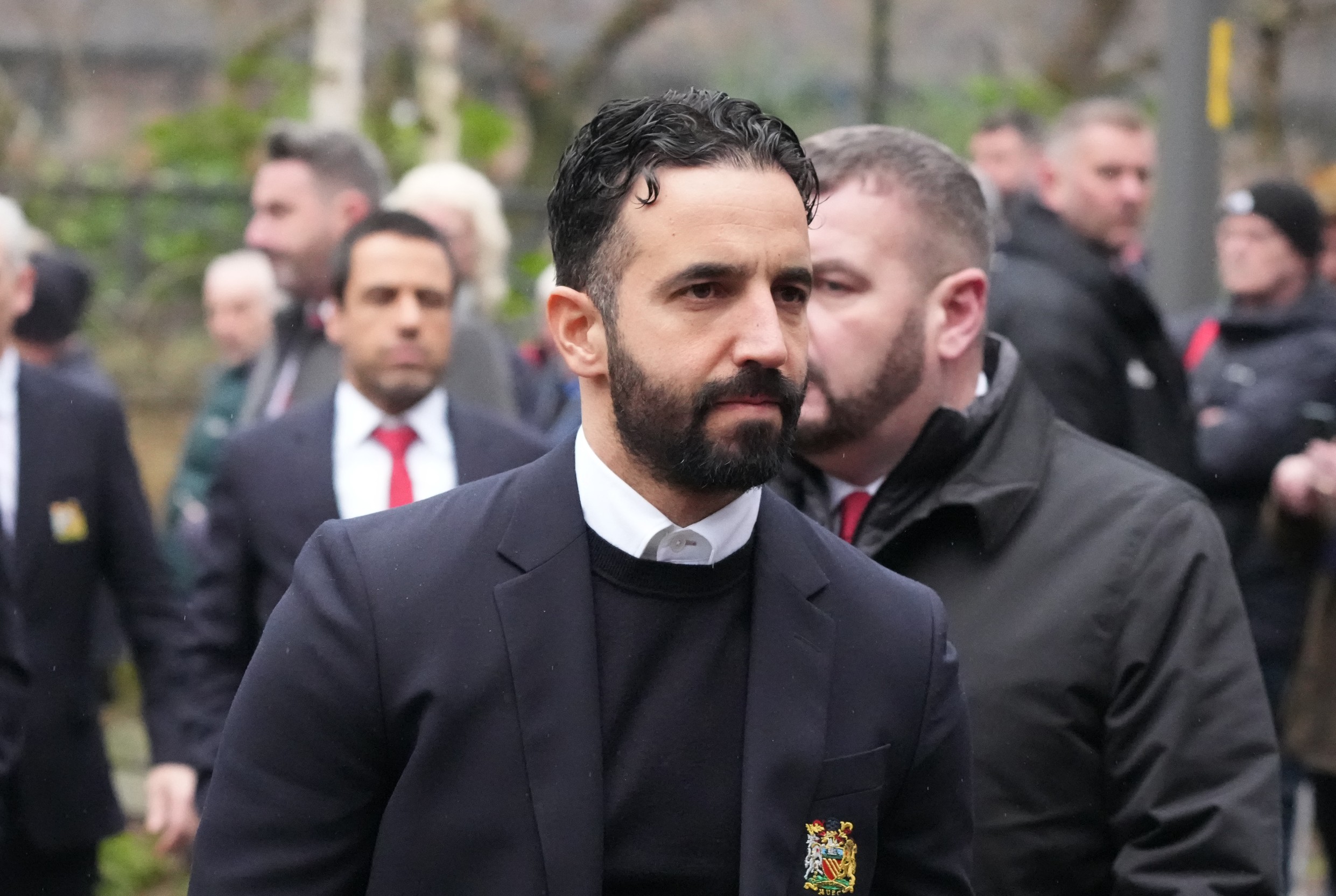 Ruben Amorim (R) arrives to attend the funeral of late Manchester United and Scotland footballer Denis Law