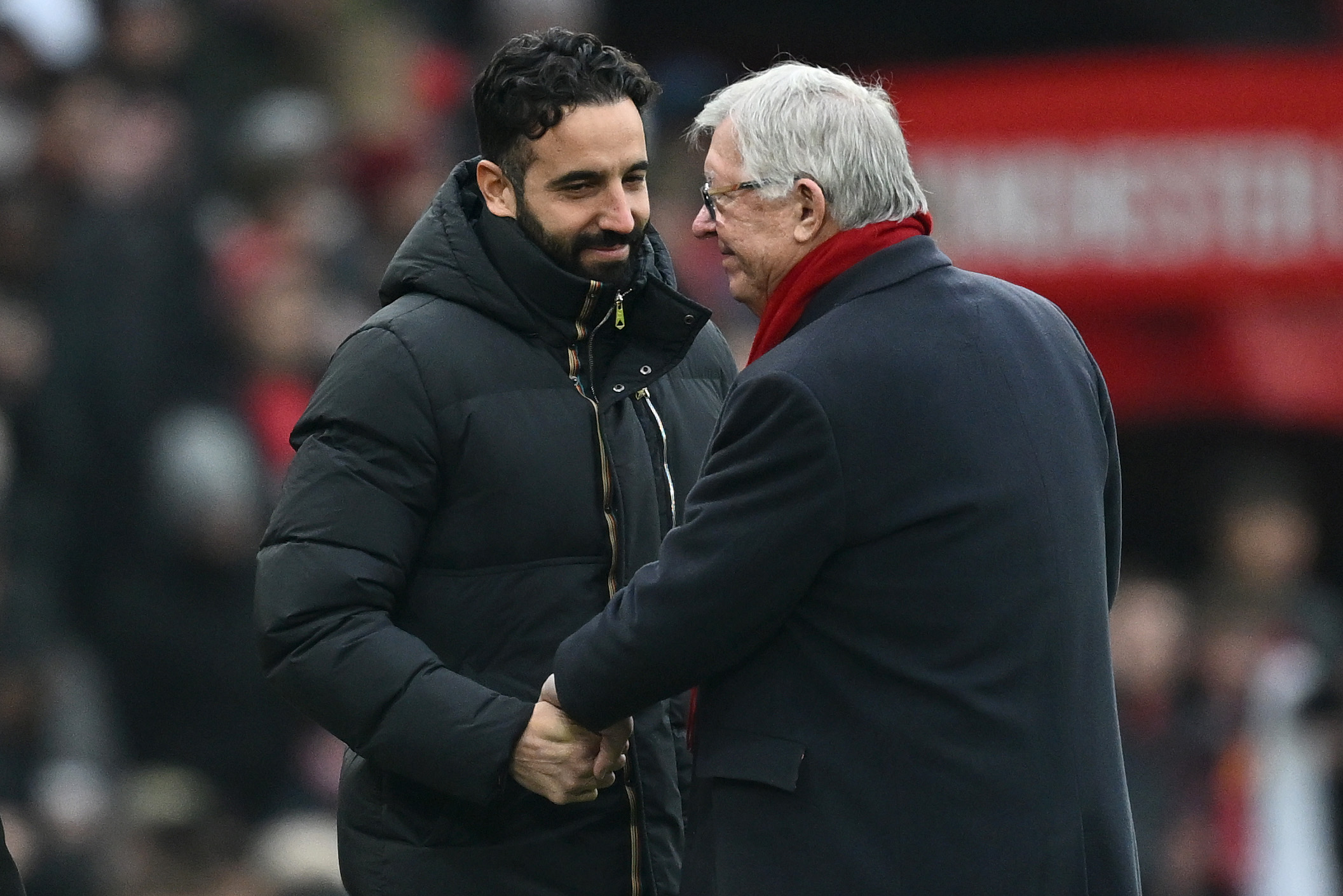 Robin Amorim, Manchester United director, talks to Sir Alex Ferguson