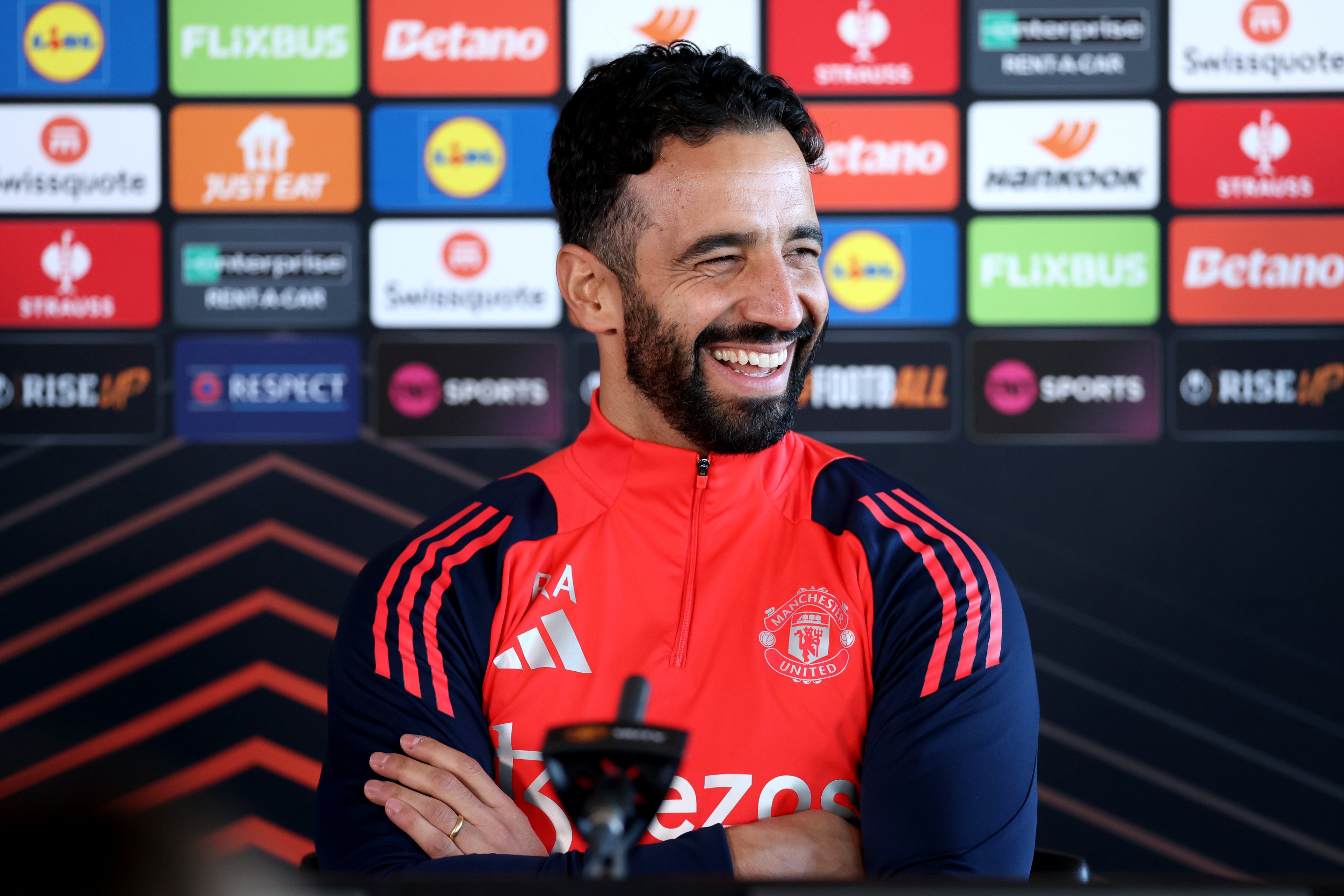 Ruben Amorim smiles at a press conference