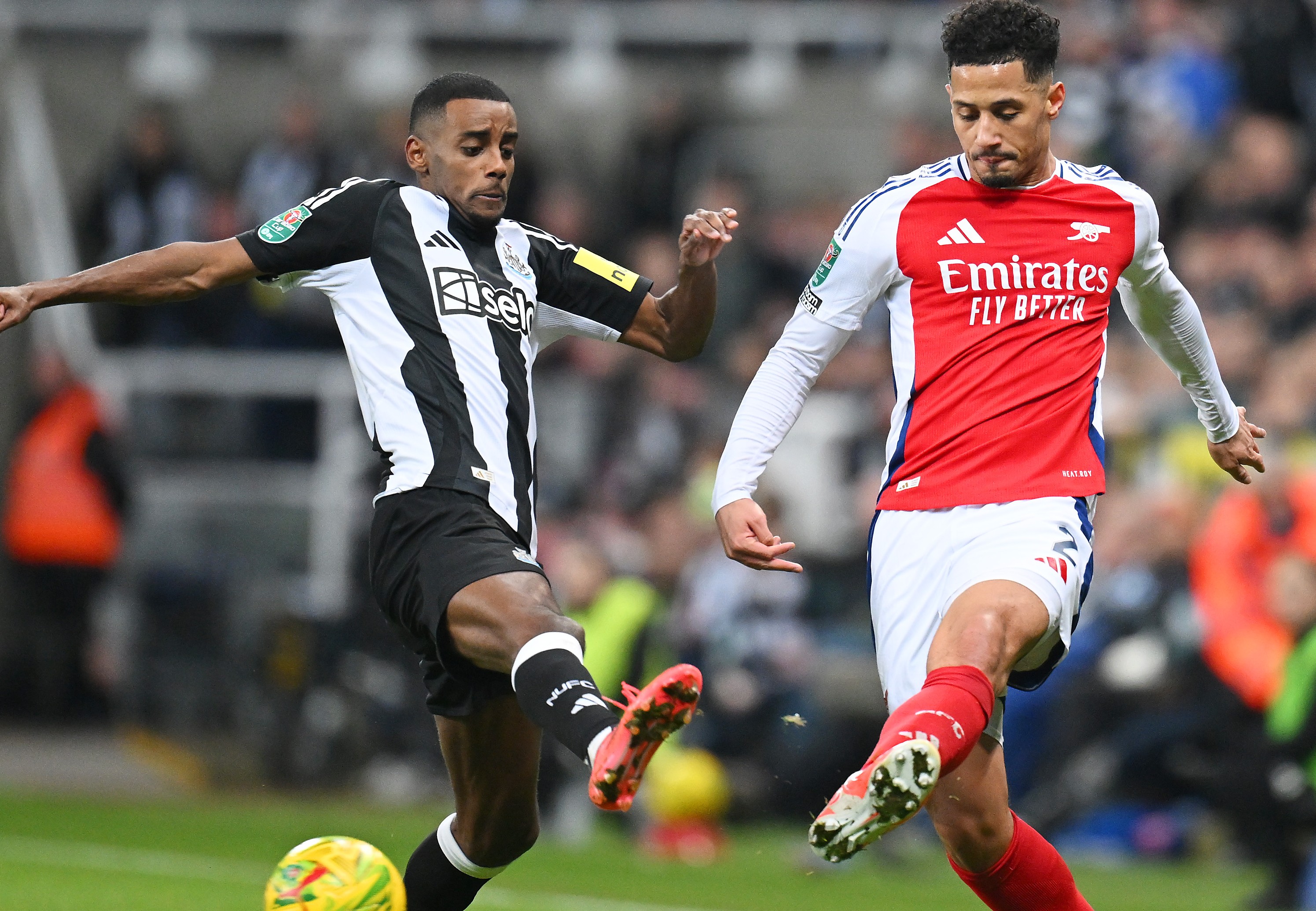 William Saliba of Arsenal is challenged by Alexander Isak of Newcastle United