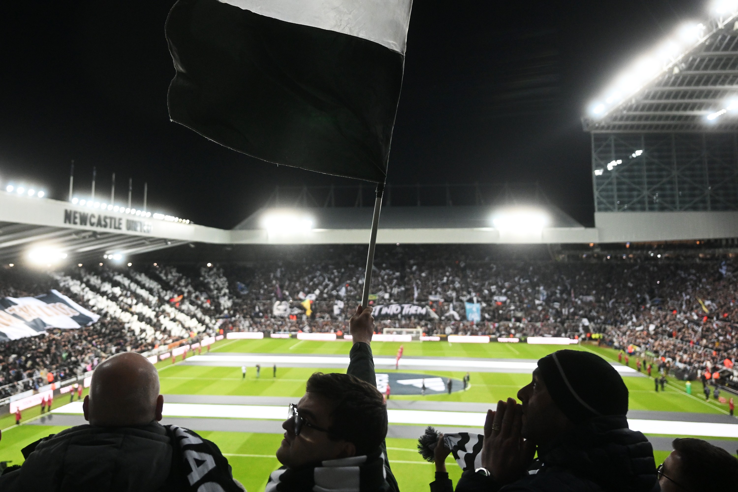 General view inside the stadium as Newcastle United fans wave a flag