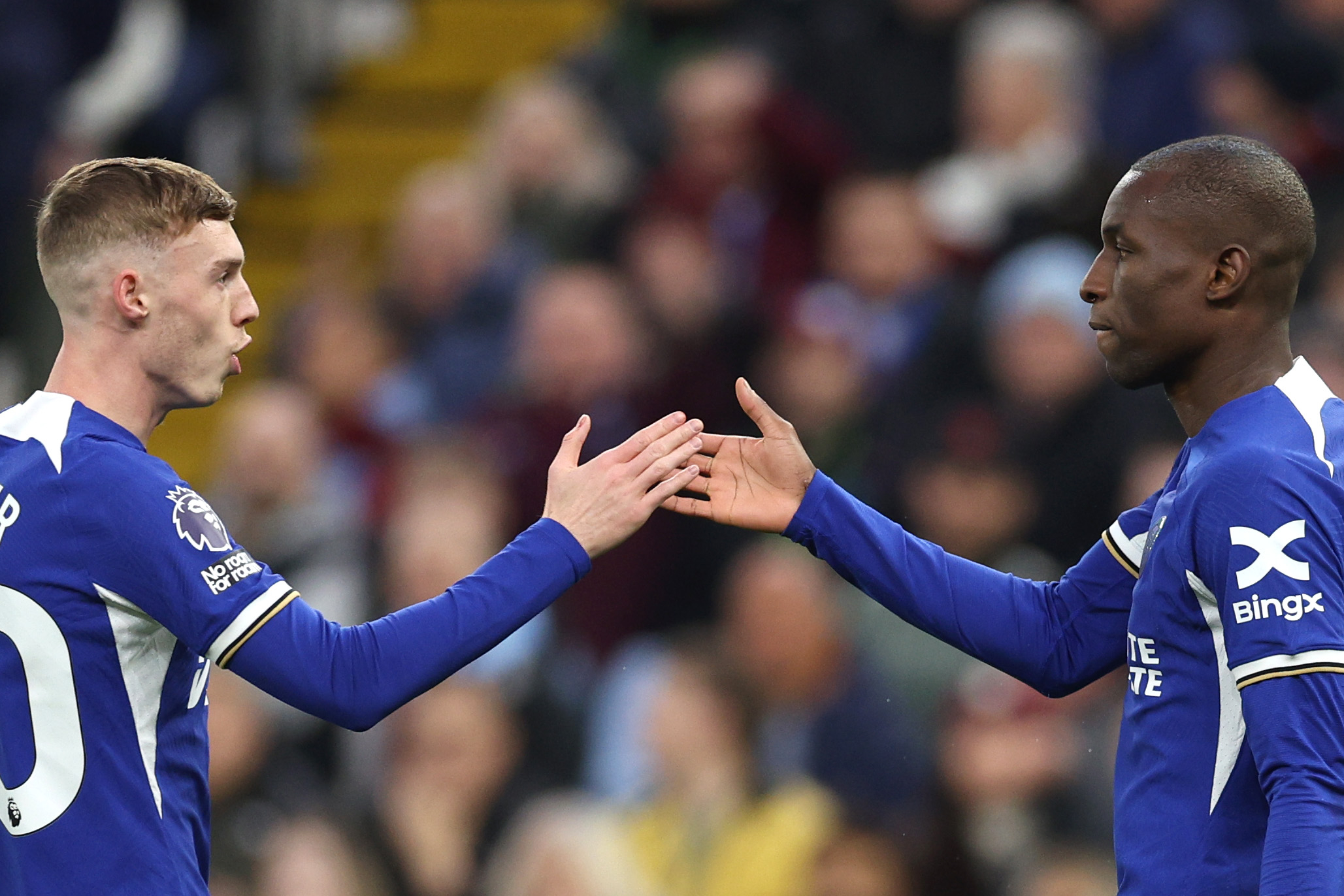 Nicolas Jackson of Chelsea celebrates after scoring a goal with teammate Cole Palmer. 