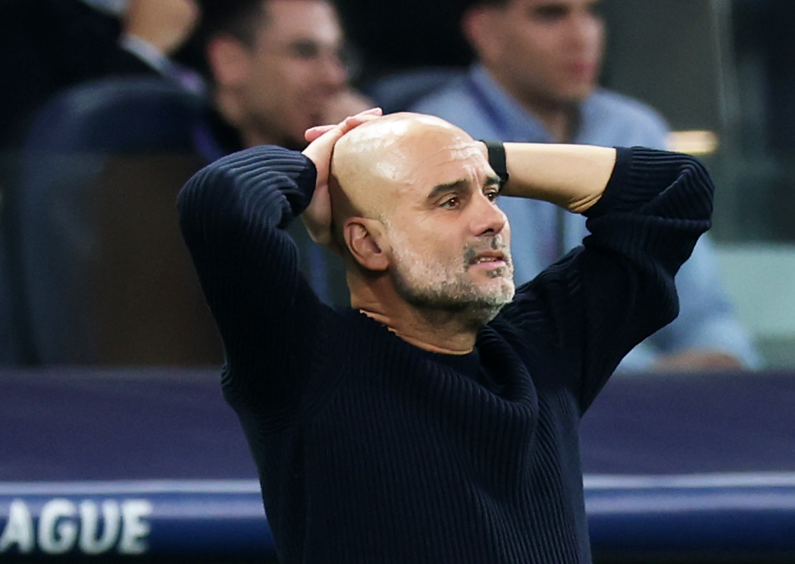 Pep Guardiola, Manager of Manchester City, reacts out of frustration