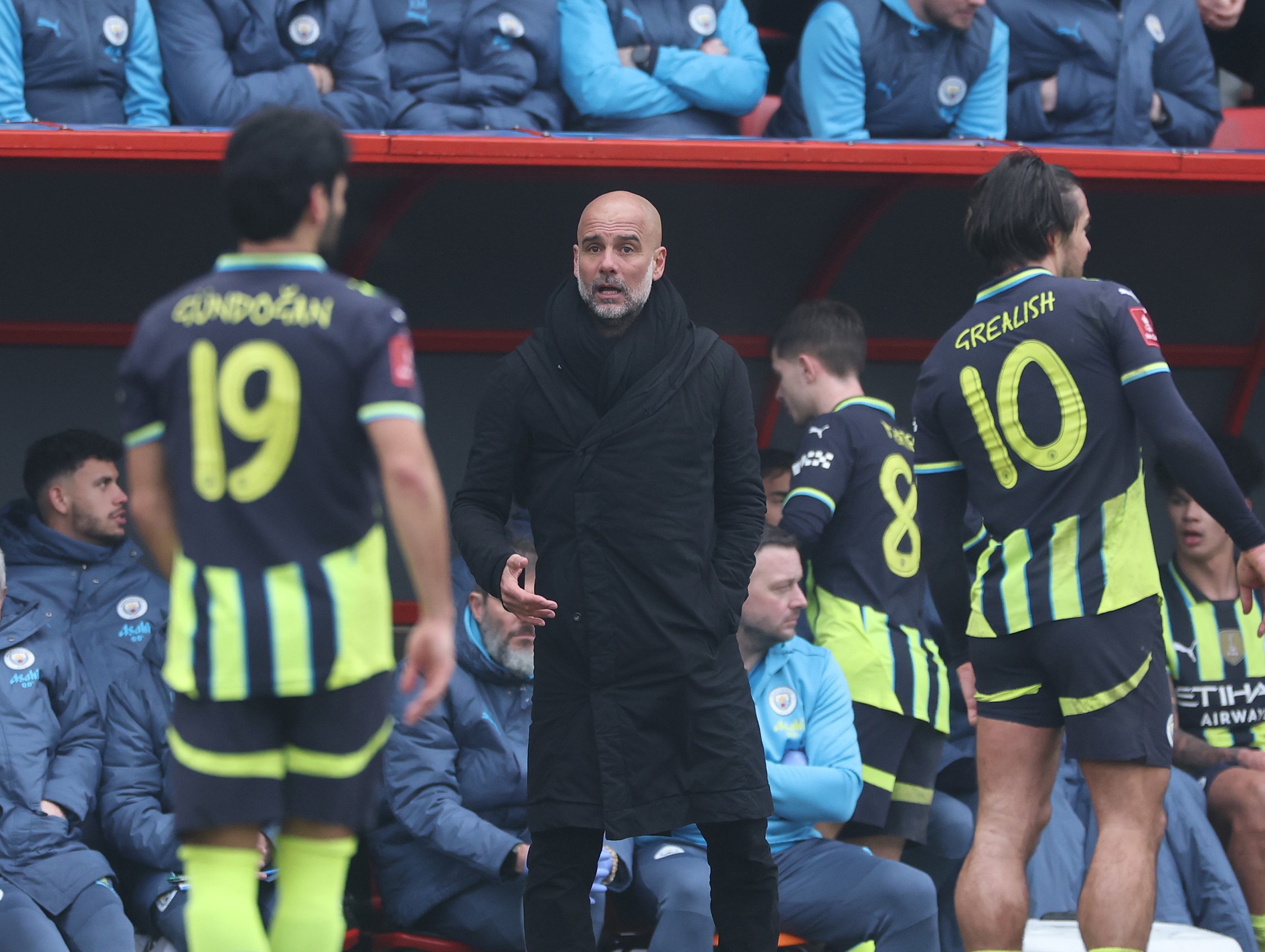 Manchester City Manager Pep Guardiola reacts with his players