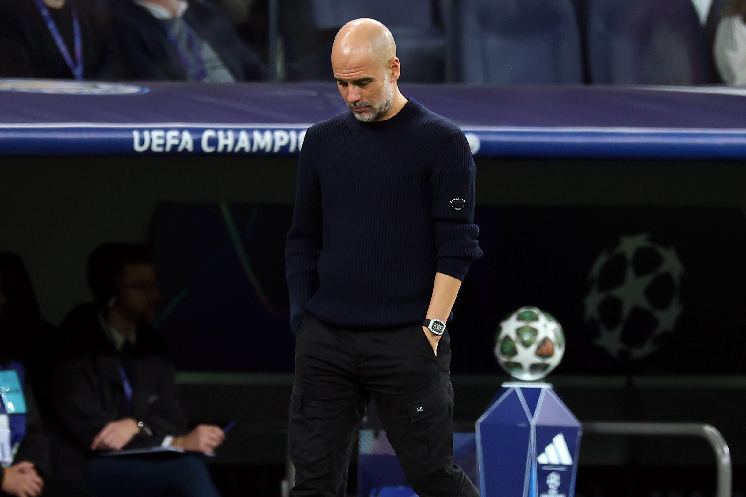 Pep Guardiola, Manager of Manchester City, looks on