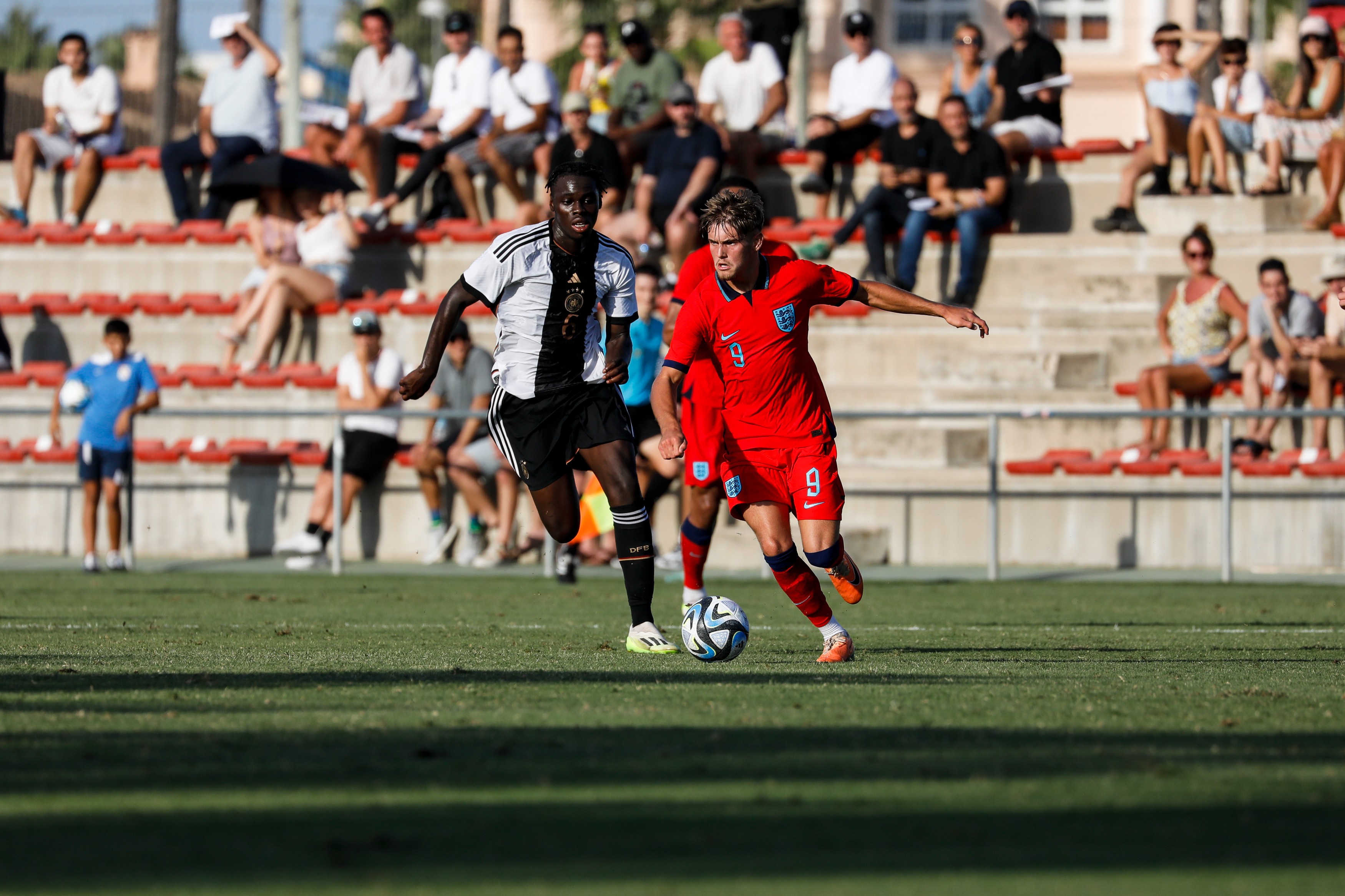 Kofy Jeremy Amoako of Germany U19 (L) competes for the ball