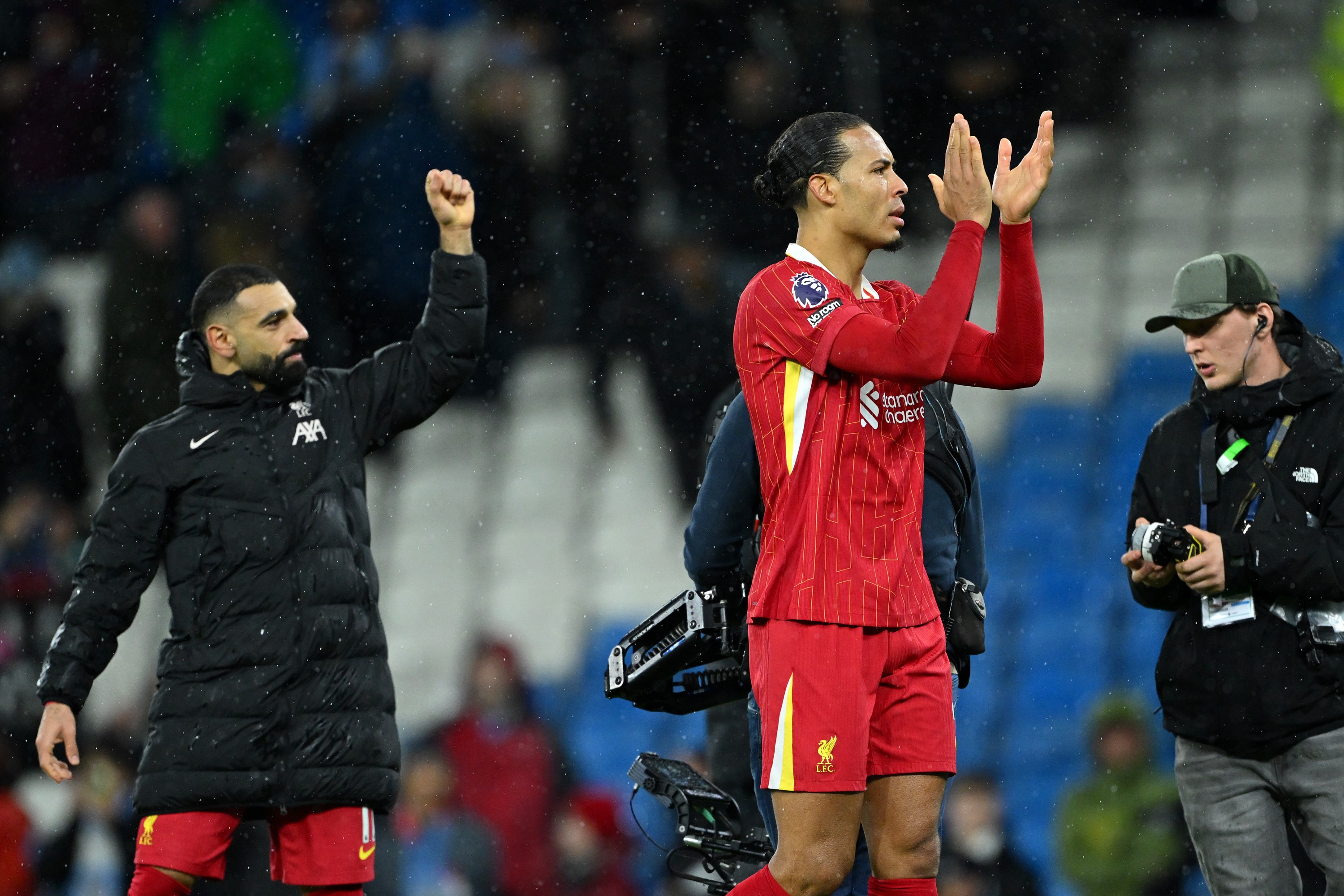 Virgil van Dijk and Mohamed Salah of Liverpool celebrate victory