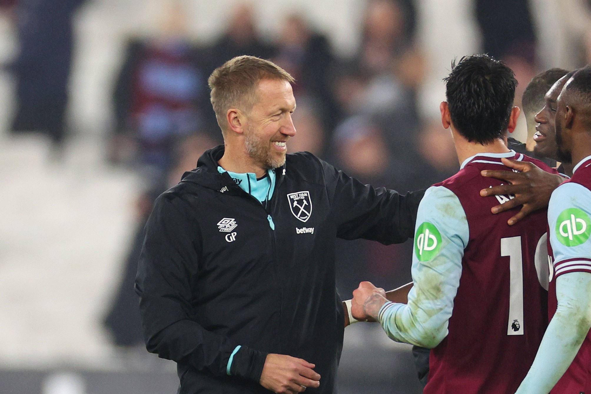 Graham Potter, lead coach of West Ham United, celebrates victory with his team 