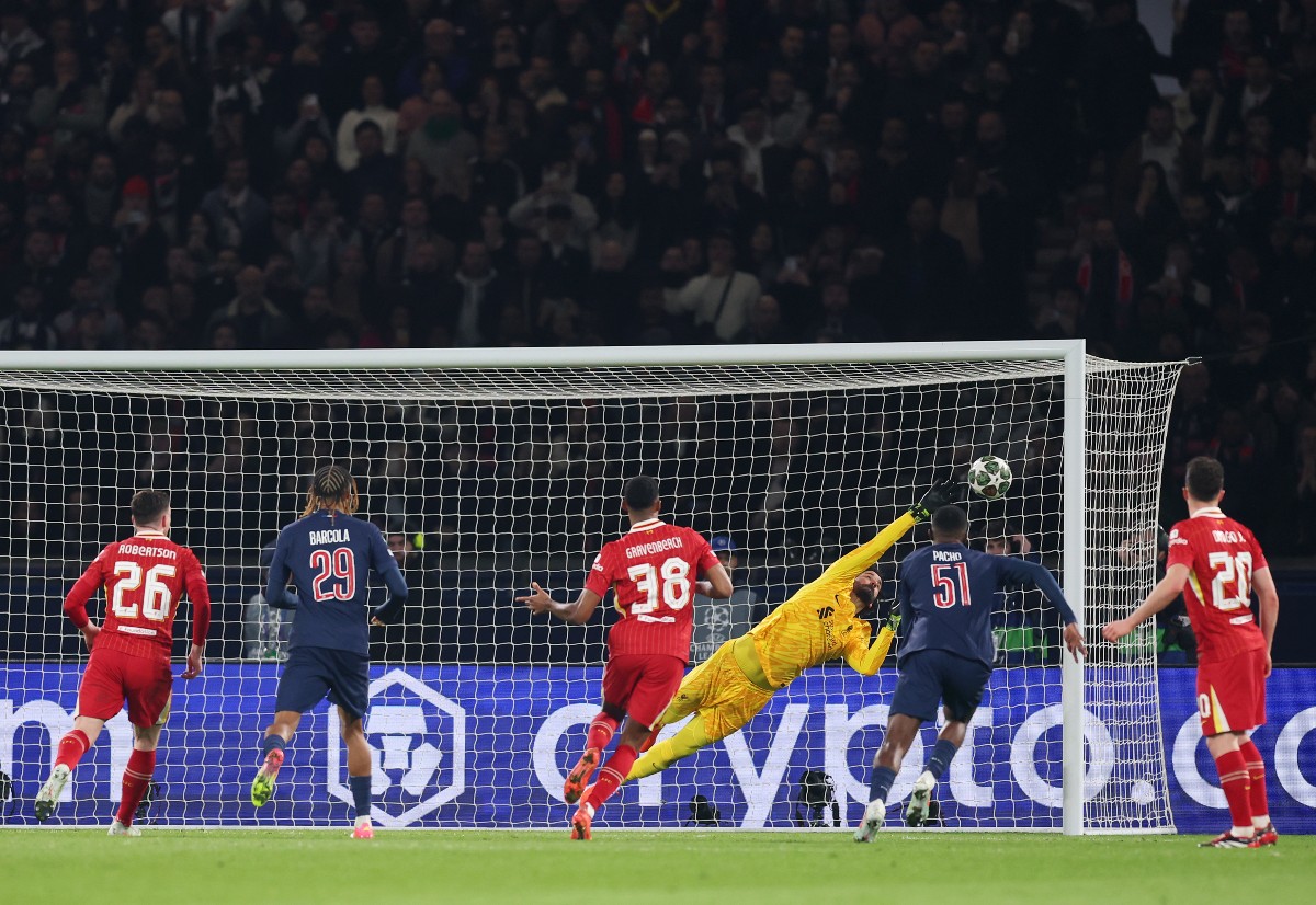 Alisson makes a save for Liverpool against PSG