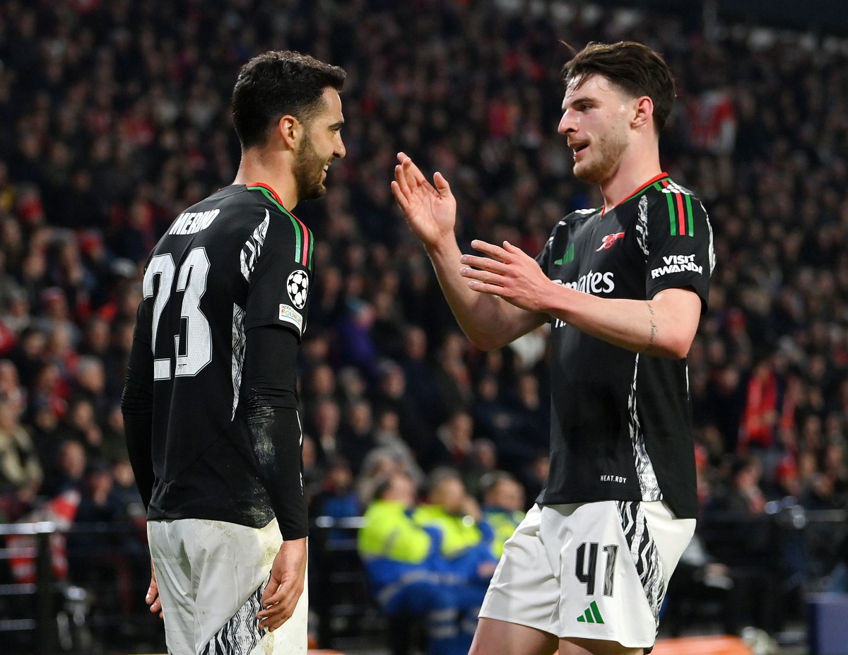 Mikel Merino and Declan Rice celebrate during Arsenal's win at PSV