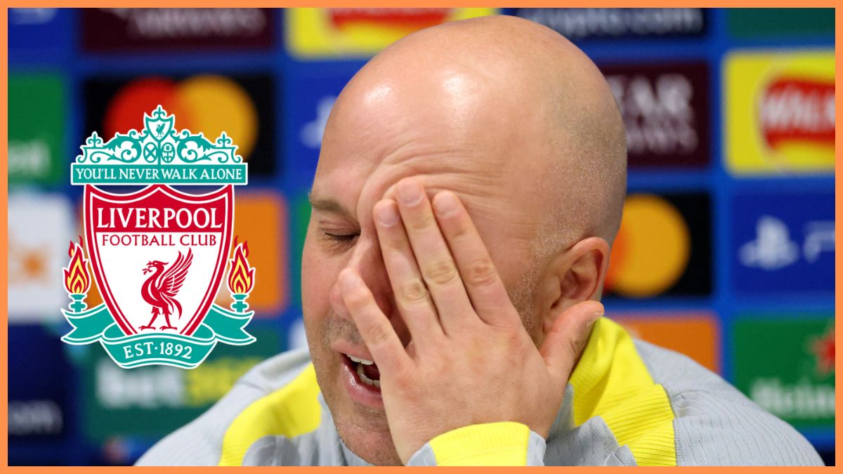 Liverpool head coach Arne Slot rubs his face with one hand.